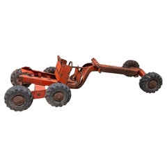 vintage 1940s–1950s Structo pressed steel orange road grader toy