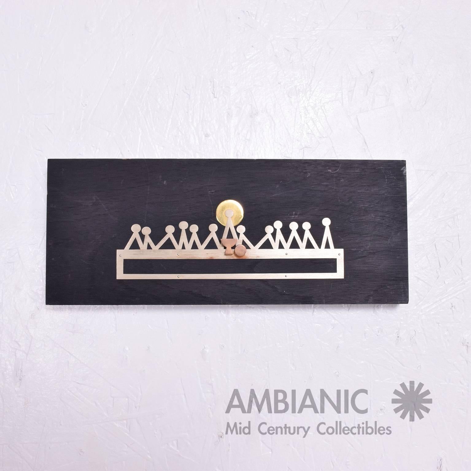 For your consideration a wall plaque made by EAMUS.

Solid mahogany wood ebonized in black paint. Modernist last supper made of silver and brass.

Measures: 4 3/4