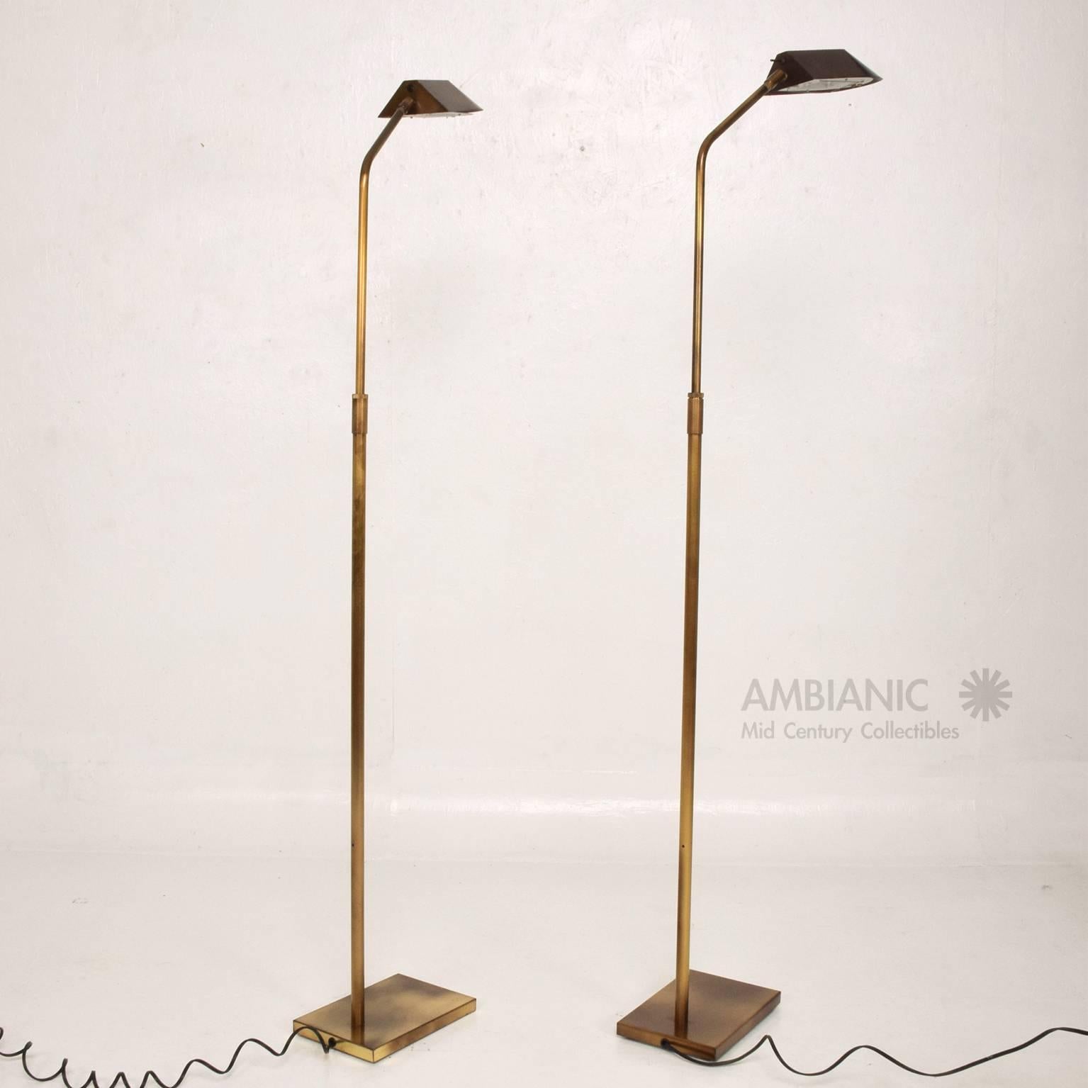 For your consideration a pair of Mid-Century Modern reading lamps by George Kovacs.
Patinated brass.
Stamped with makers label underneath. 
56 1/2