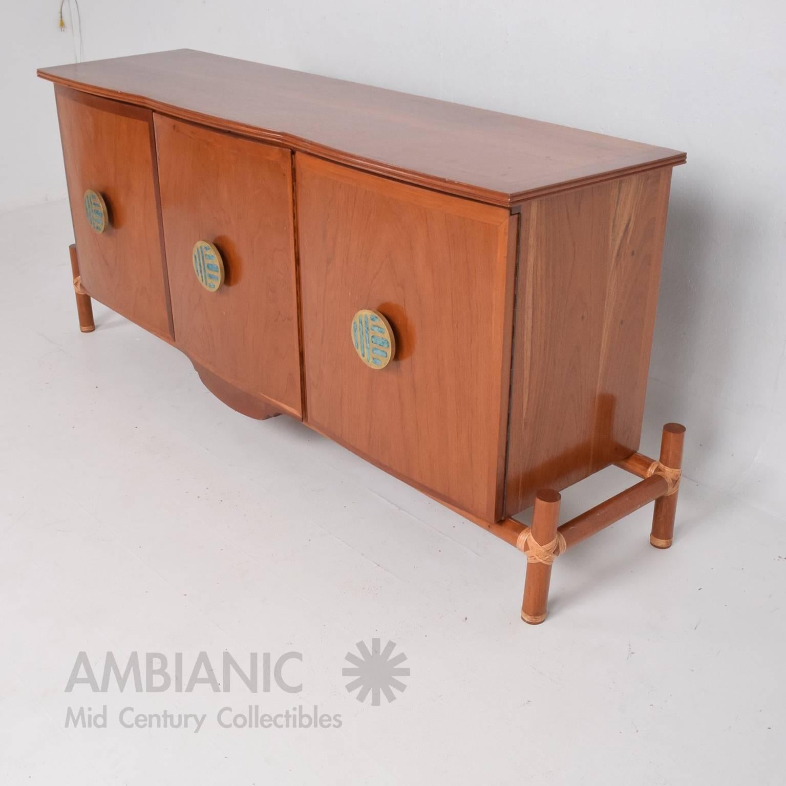 For your consideration a credenza or cabinet made in Mexico circa 1960s, 
Mahogany wood with beautiful bronze pull with malachite.

Cabinet is unsigned, no label present from the maker. Pulls are stamped with Mendoza logo. 

Measures: 35"