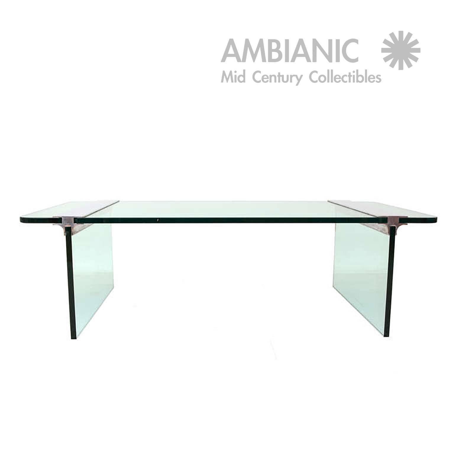 For your consideration a coffee table by PACE. Thick glass with polished aluminum supports.

 It can be plated per clients specifications.
