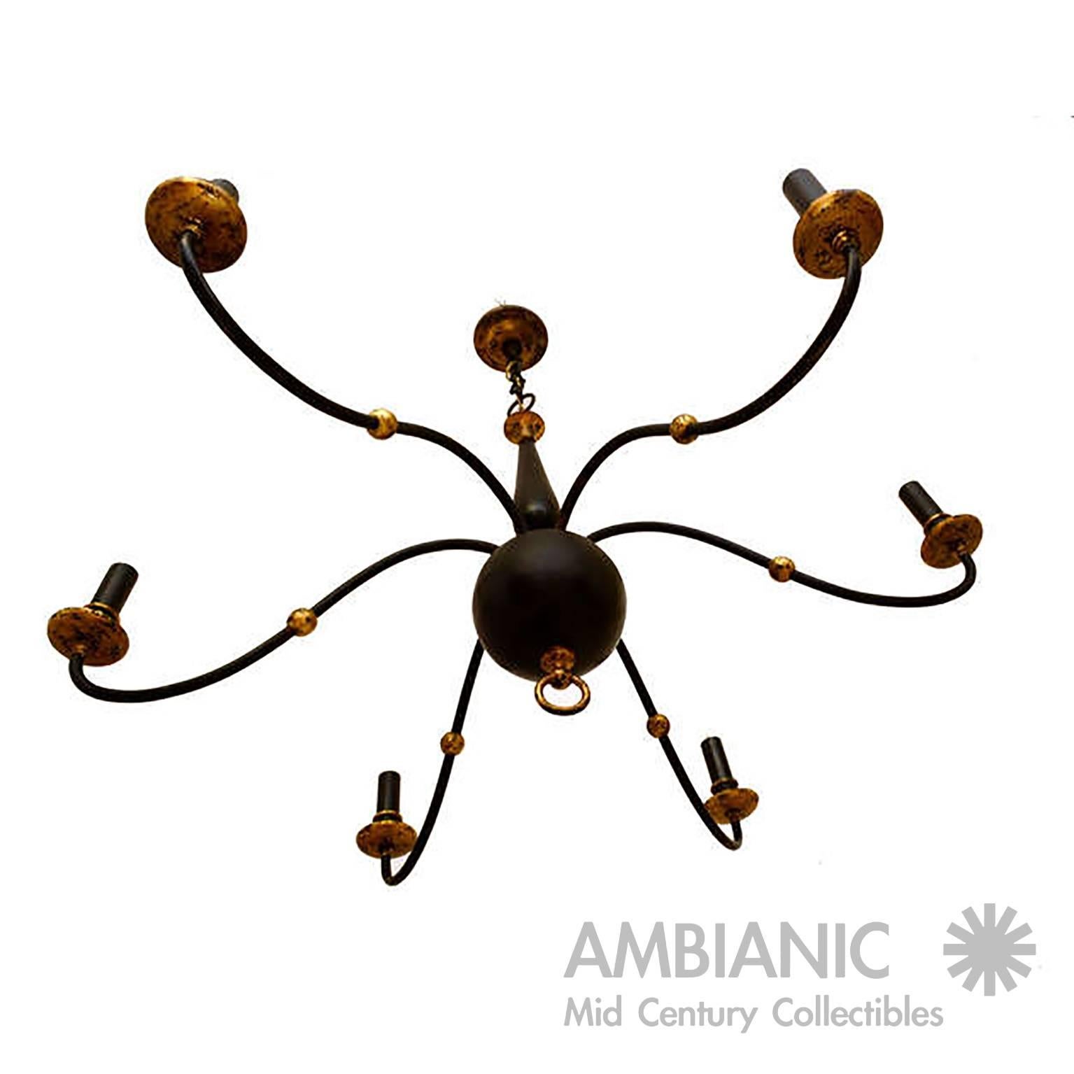 French inspired chandelier attributed to Mexican designer Arturo Pani. 
Sculptural tubular steel painted in flat black (original paint) with accents in gold paint. 
Made in Mexico circa 1950s.

Total of six bulbs, will ensure proper lighting to