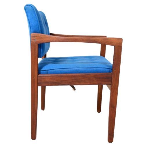 Sculptural Side Chair
Midcentury modern office armchair solid walnut wood frame.
Style of Gerald McCabe. Unmarked.
Original upholstery in tufted blue fabric
Chair has a built-in armrest with lovely sculptural shape. 
Mounted on metal glides.
Retains