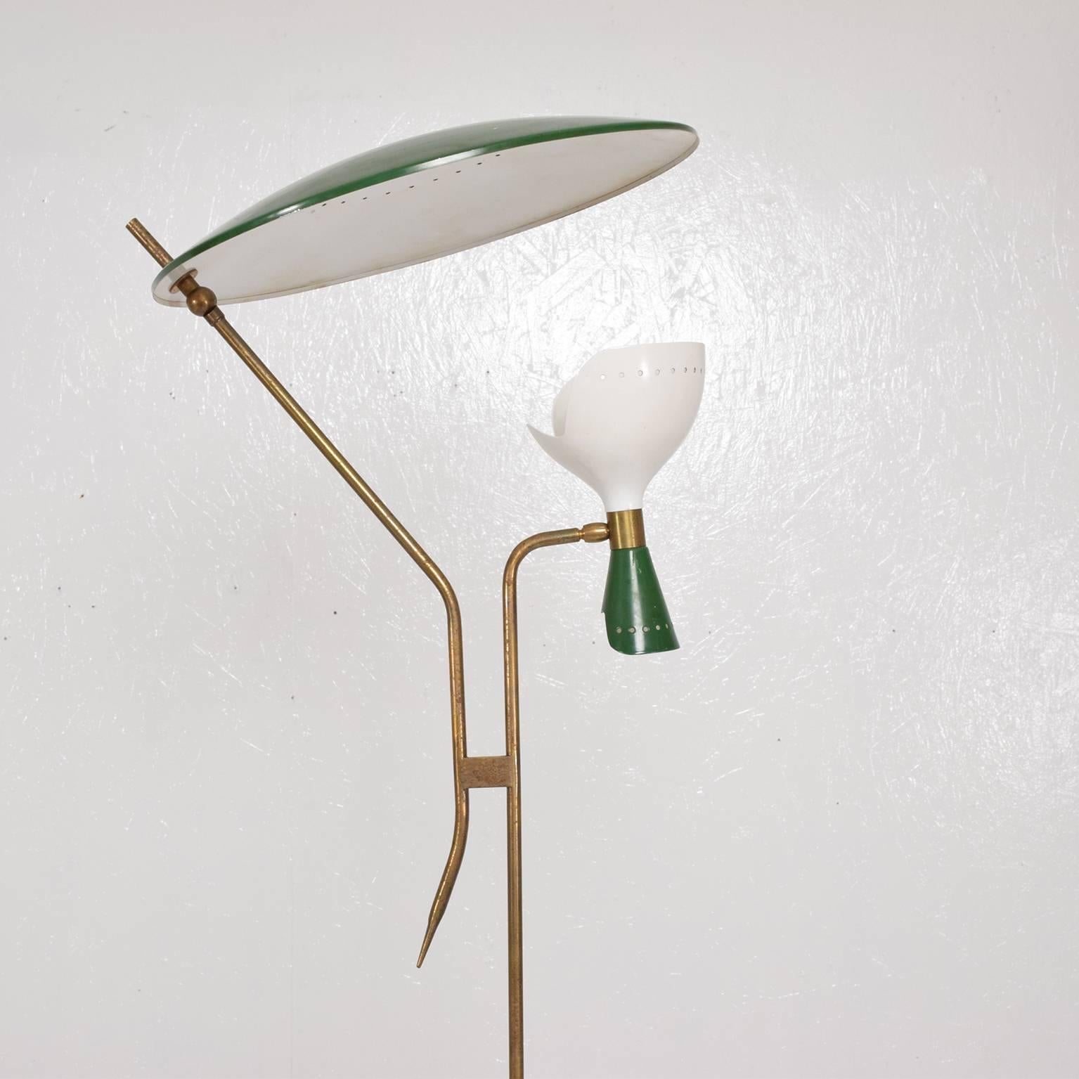 For your consideration a beautiful sculptural floor lamp. Attributed to Stilnovo. Made in Italy. Stamp from the maker not present. 
Brass body with original patina. Dark green marble base with green reflector in top and dual cone shade in