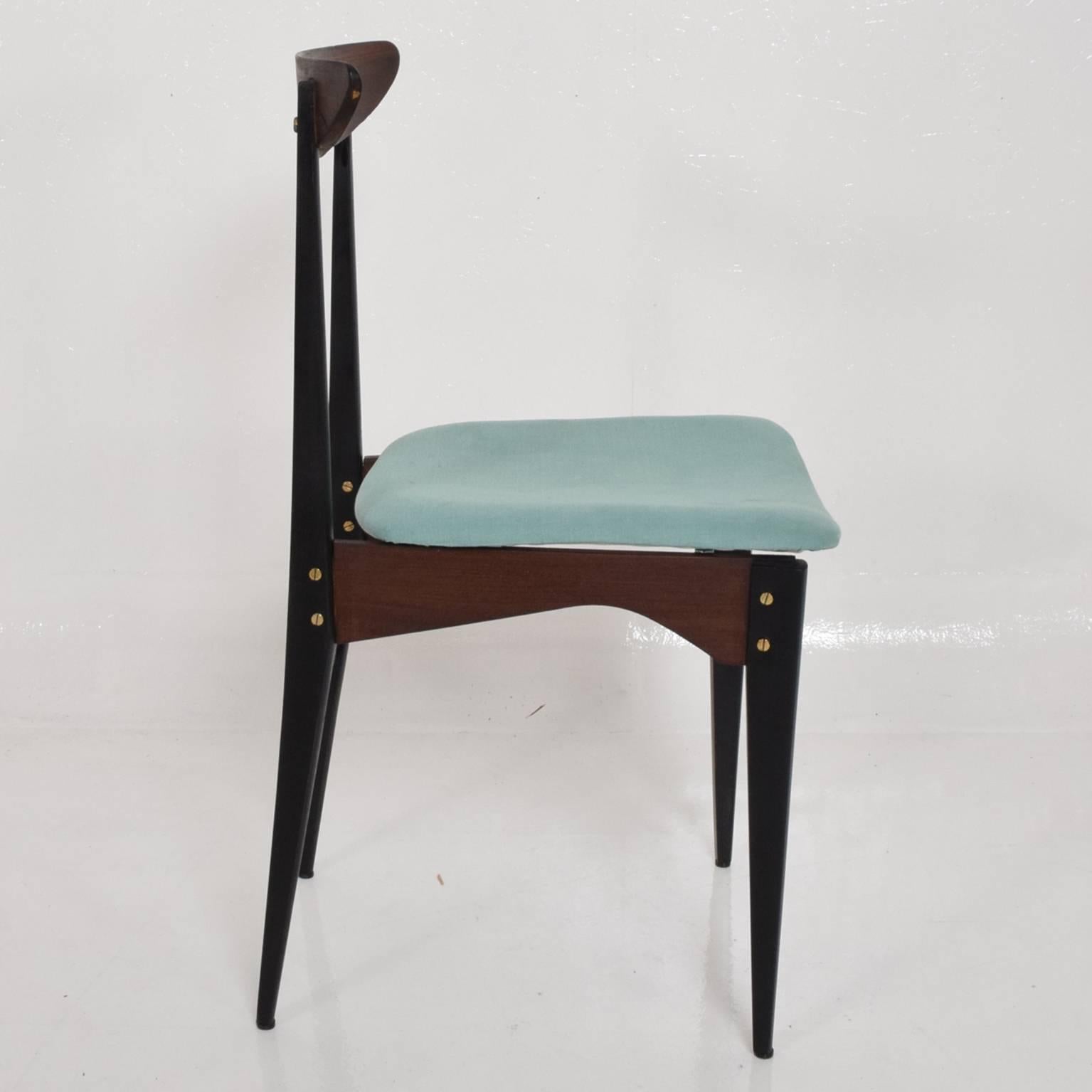 A side chair in the style of Gio Ponti. Made in Italy circa 1950s. 
Sculptural wood frame with brass accents. New upholstery. 
Unmarked. 
Dimensions: 32 3/4" H x 18" D x 16" W x S 18 1/2" H.