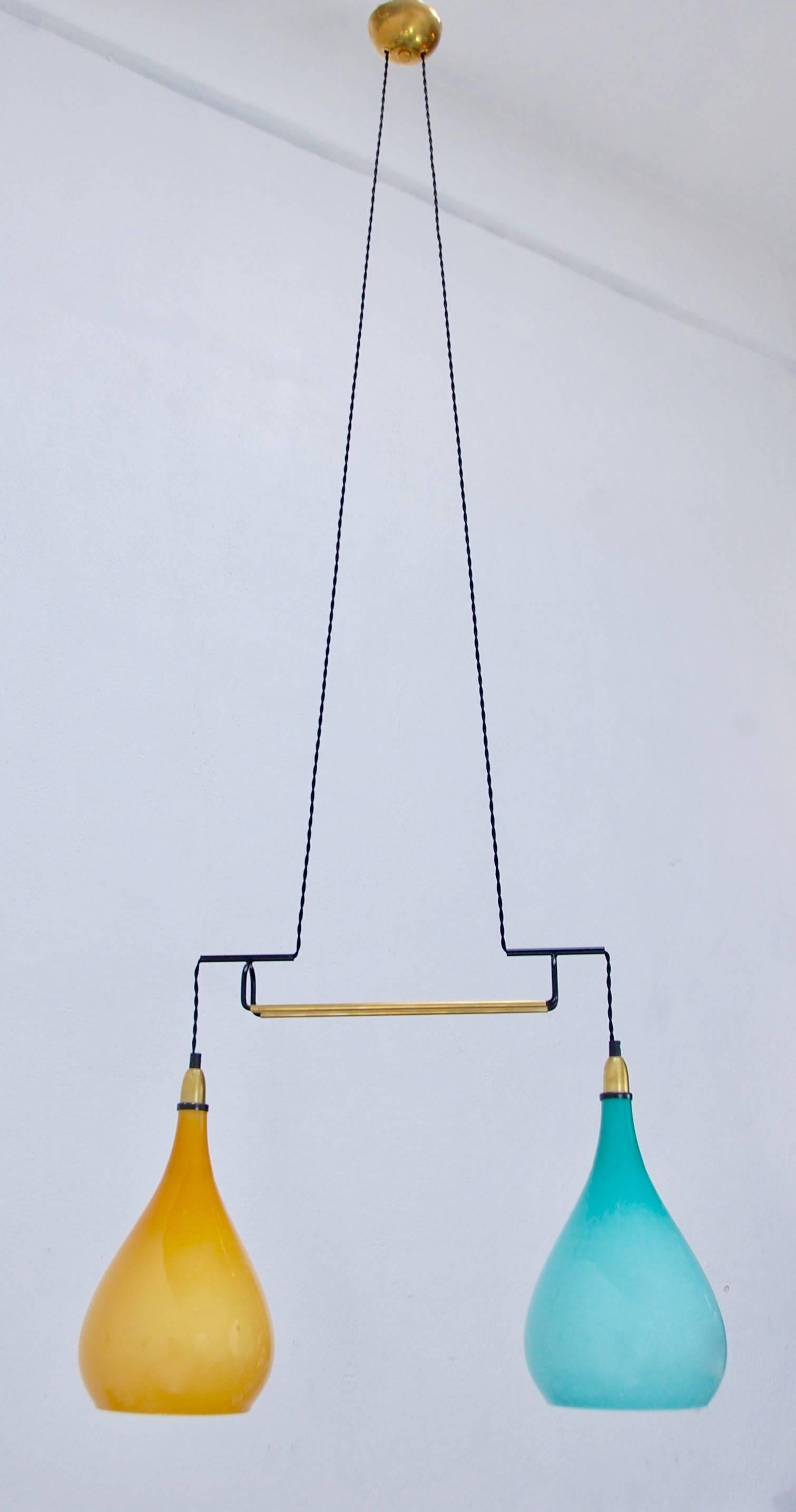 Of the period beautiful Italian 1950s double colored glass Italian pendant. Fully restored, single E26 medium based socket in each glass shade, wired for the US. Overall drop adjustable upon request to a certain degree.
We at Lumfardo Luminaires do