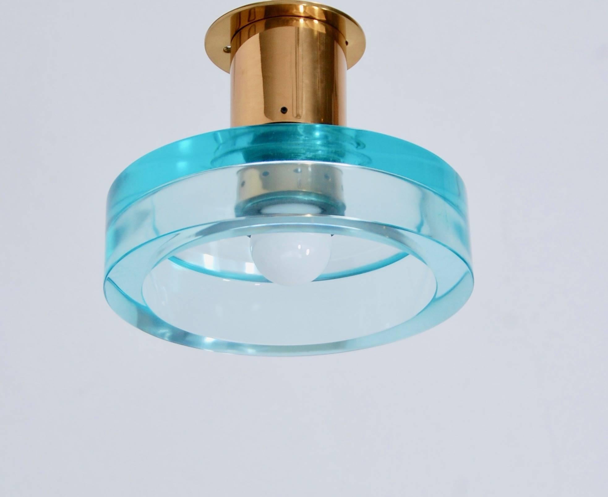 Two classical Seguso ceiling fixtures from midcentury, Italy. One in light blue, and one in dark blue. Partially restored. (1) E26 medium based socket per fixture. In patinated brass and glass.