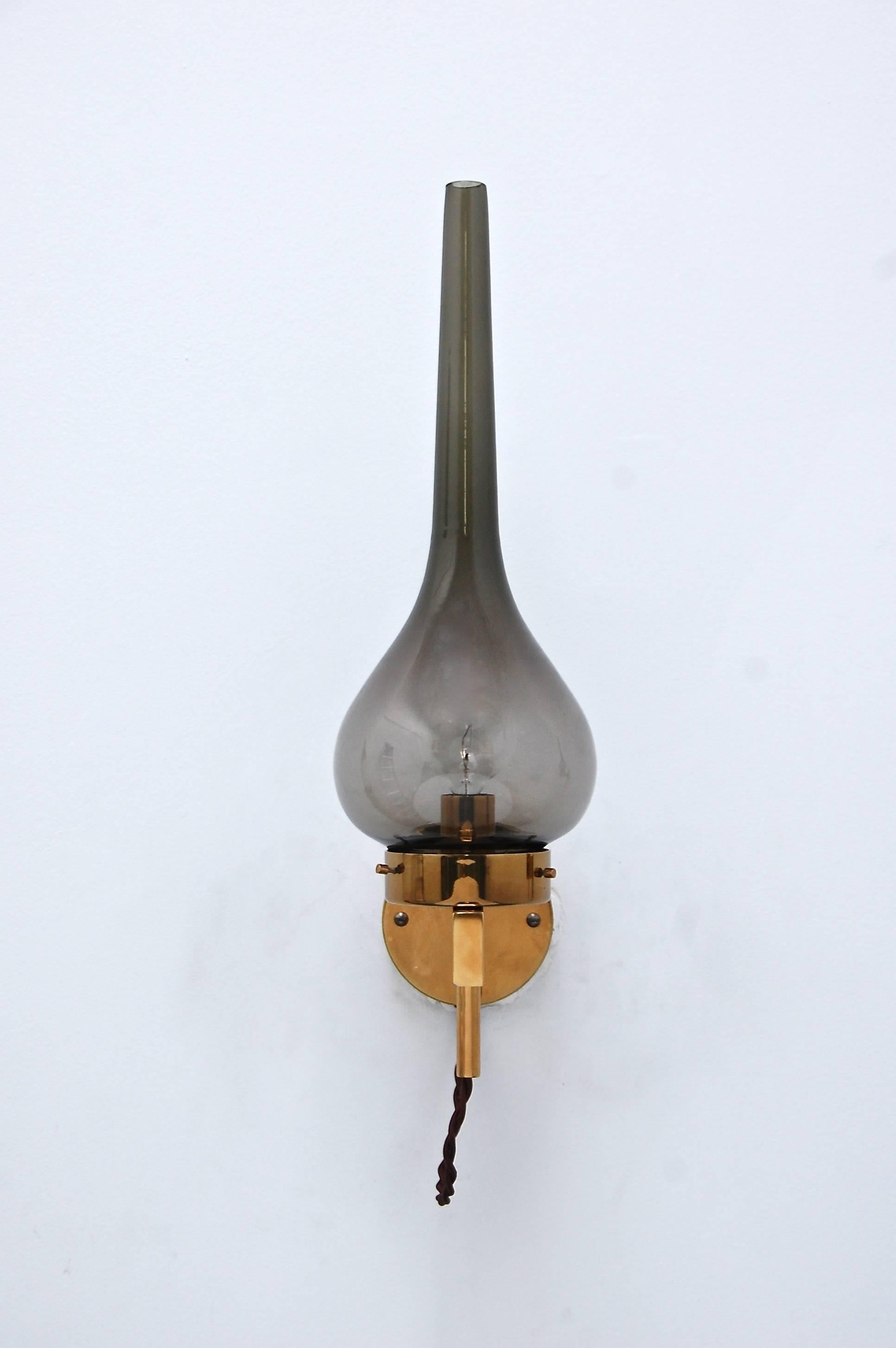 Stunning smoked glass Swedish sconce with beautiful polished brass hardware from the 1960s. Rewired for use in the US. Candelabra based socket.