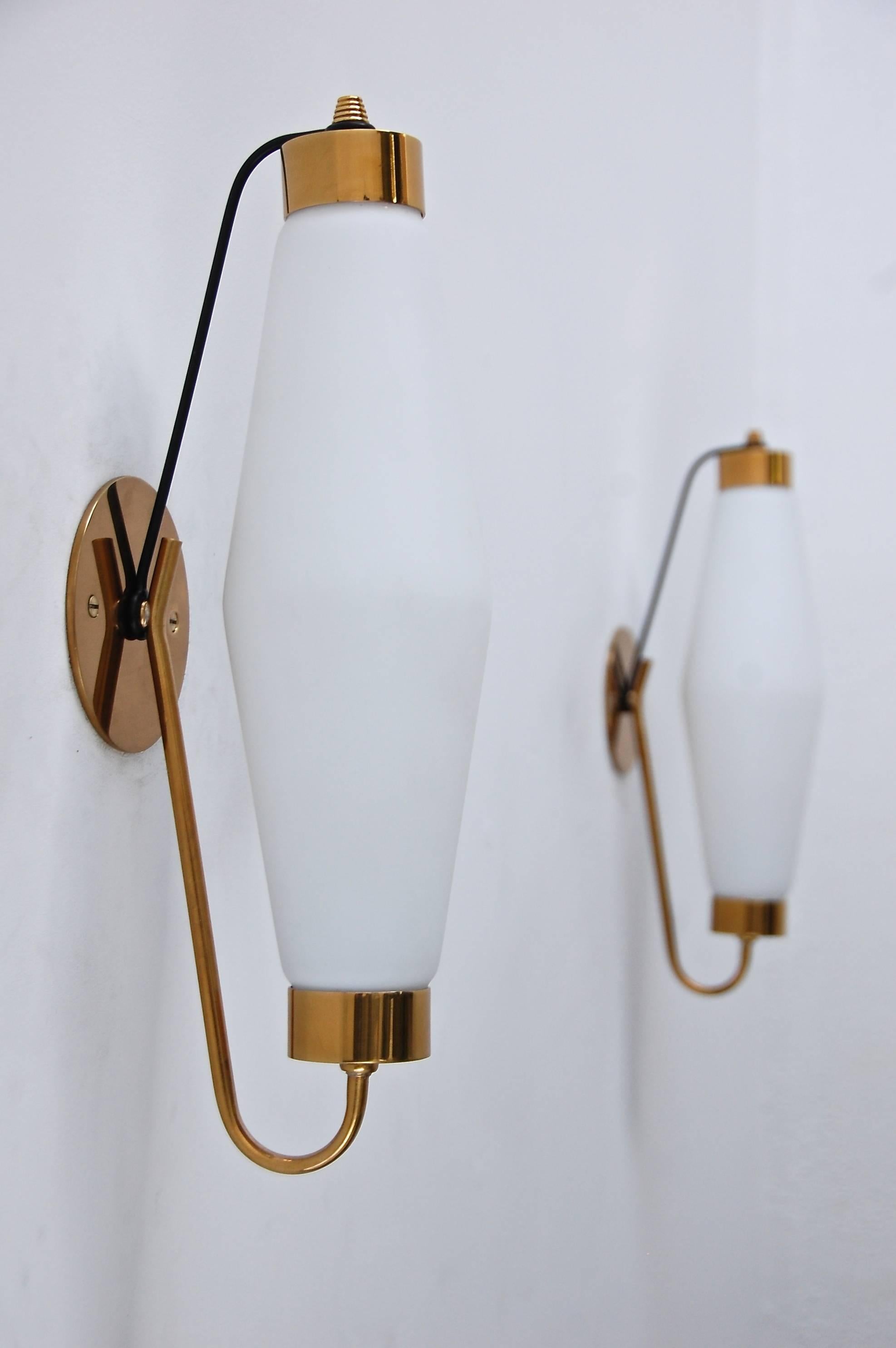 A pair of elegant brass and steel Italian Mid-Century sconces with beautiful diamond shaped glass shades. These sconces are nice companion pieces to our (Eight) arm Italian Chandeliers.