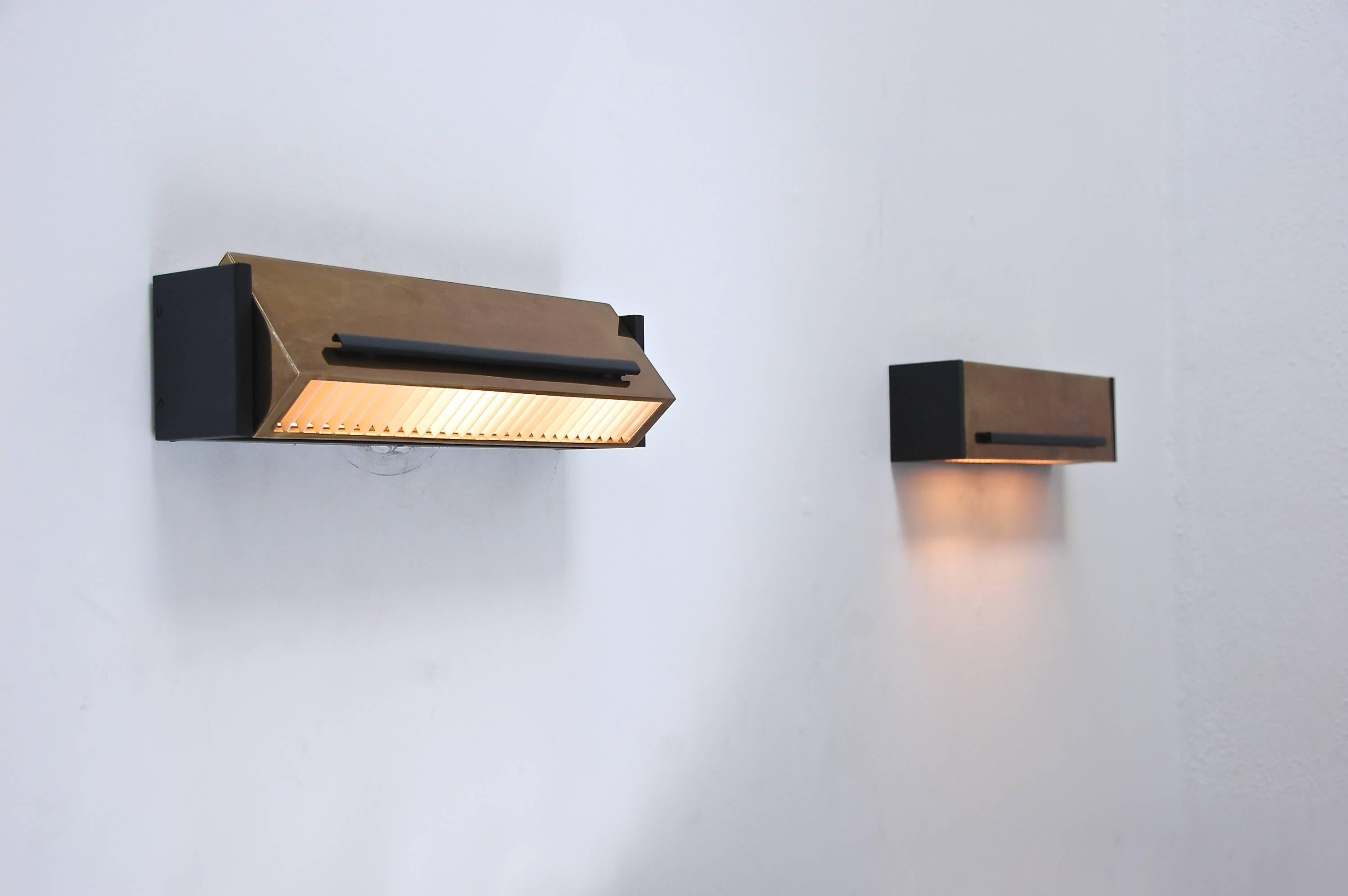 Sharp and elegant Directional geometric sconce from France.