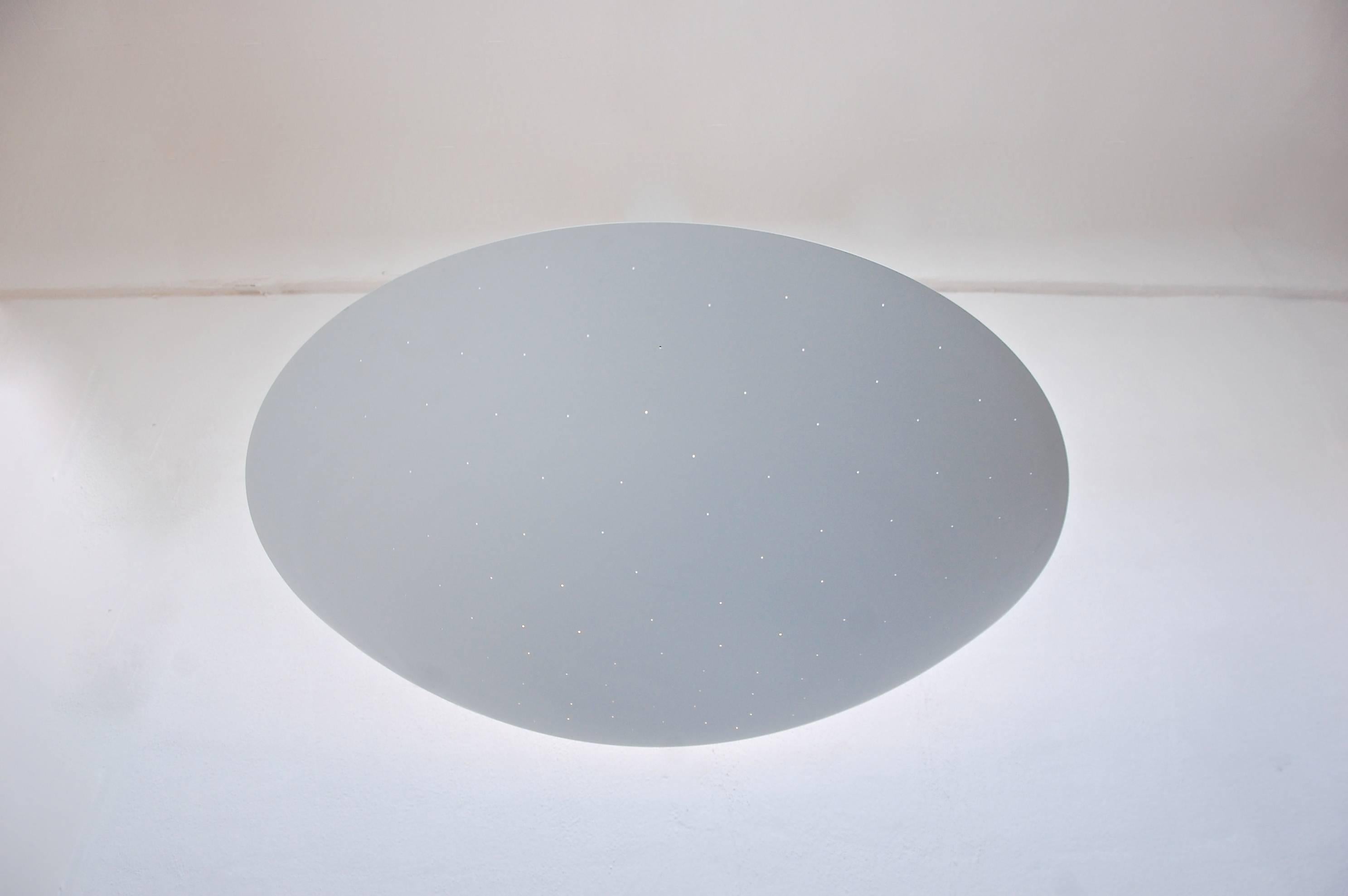 Large white perforated ceiling dish.