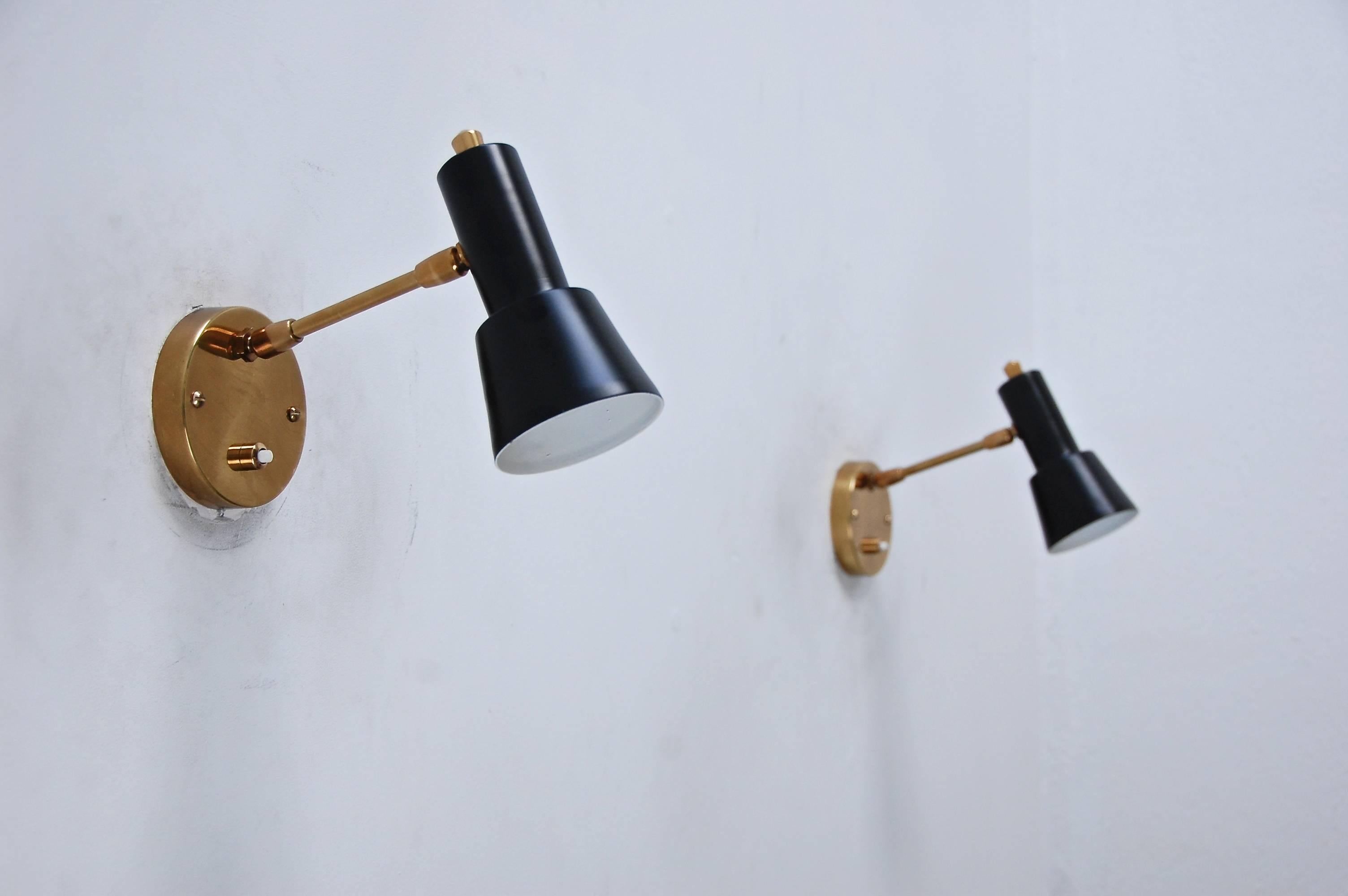 Adorable, articulating black and brass reading sconces from Italy, 1950s, Mid-Century Modern.