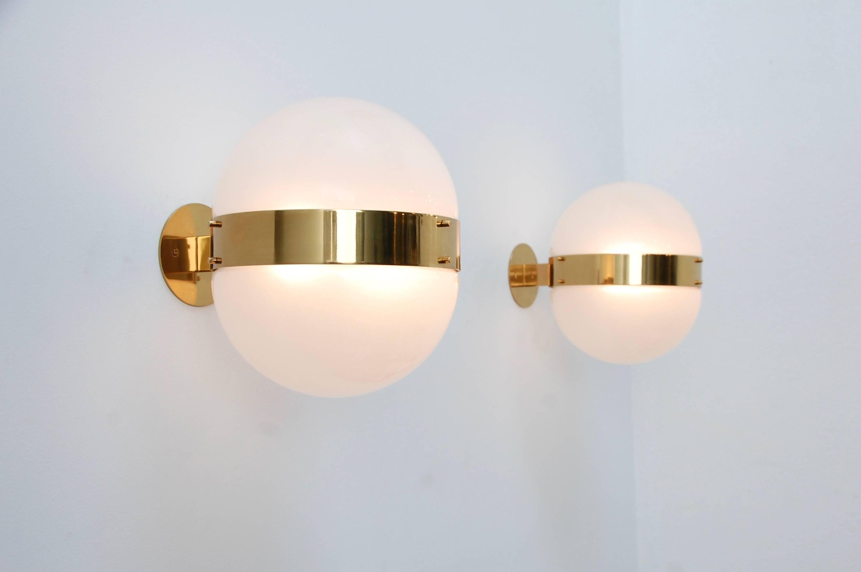 (3) beautiful glass and brass Sergio Mazza sconces by Artemide from Italy. These sconces are fully restored and wired with 2 E26 medium based sockets. Lightbulbs included with order. 

Measurements: 
height 12”,
depth 12.75”, 
width 10”
backplate