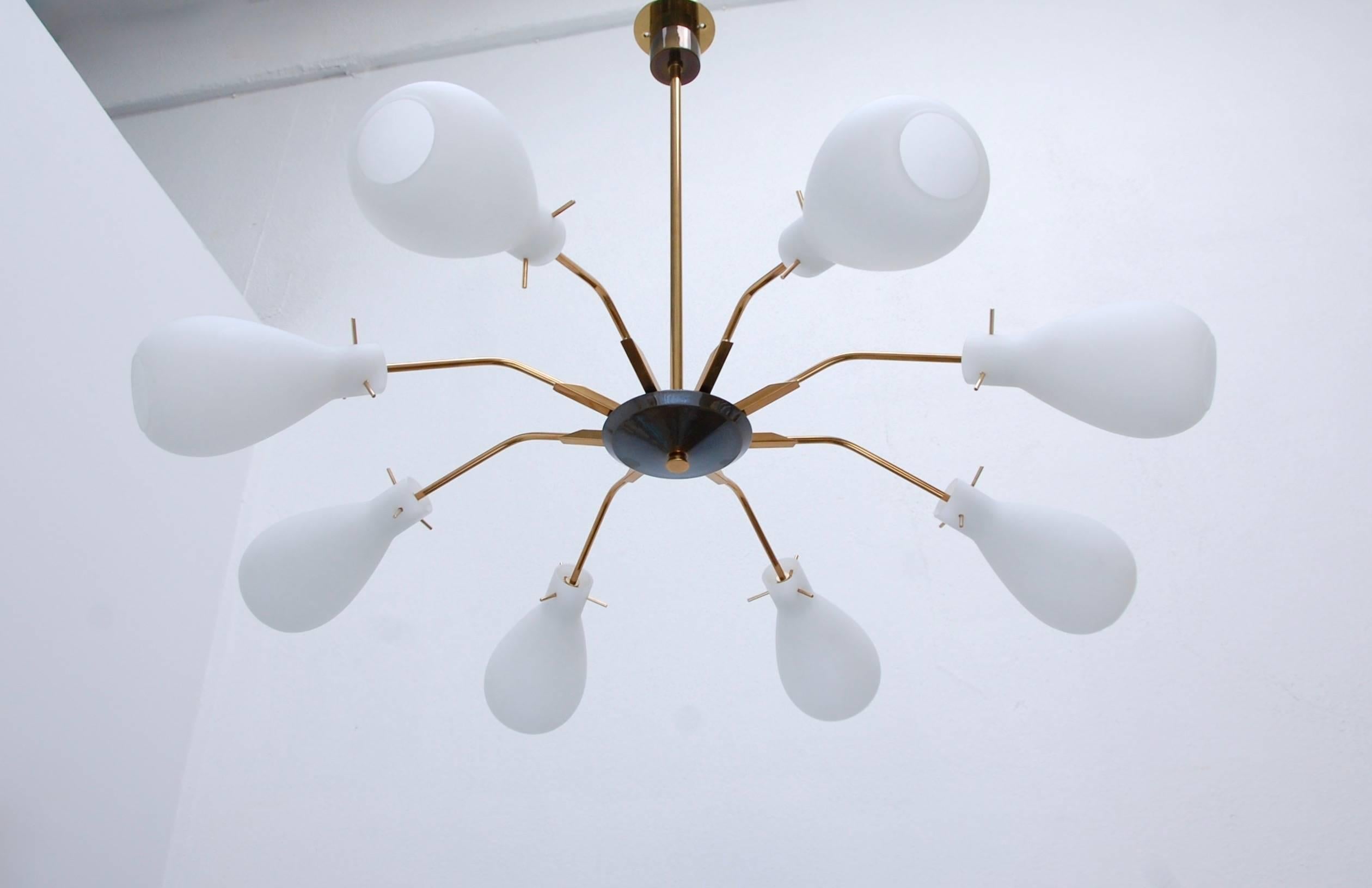 Stunning Mid-Century Italian chandelier with eight beautiful blown glass shades. Single candelabra based socket per arm. Drop can be adjusted by request.
Measures: Chandelier height: 7”.
Diameter: 37”.
OAD: 30”.
                             