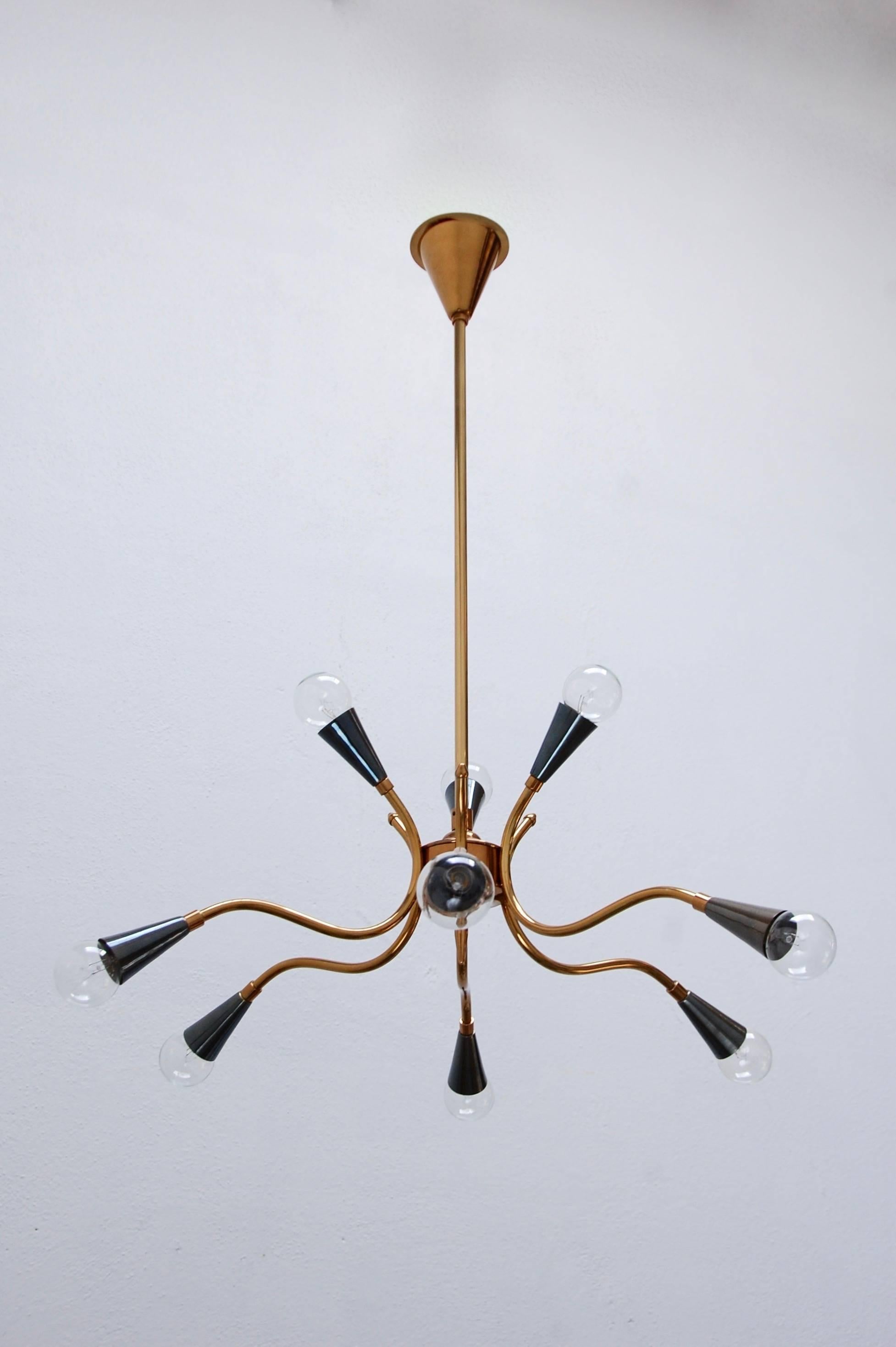 Solid brass Italian Sputnik with nine lights. Candelabra based sockets. Beautifully restored, and rewired for use in the US.
Drop: 31.25”.
Fixture height: 11”.
Diameter: 25” with bulbs.
 