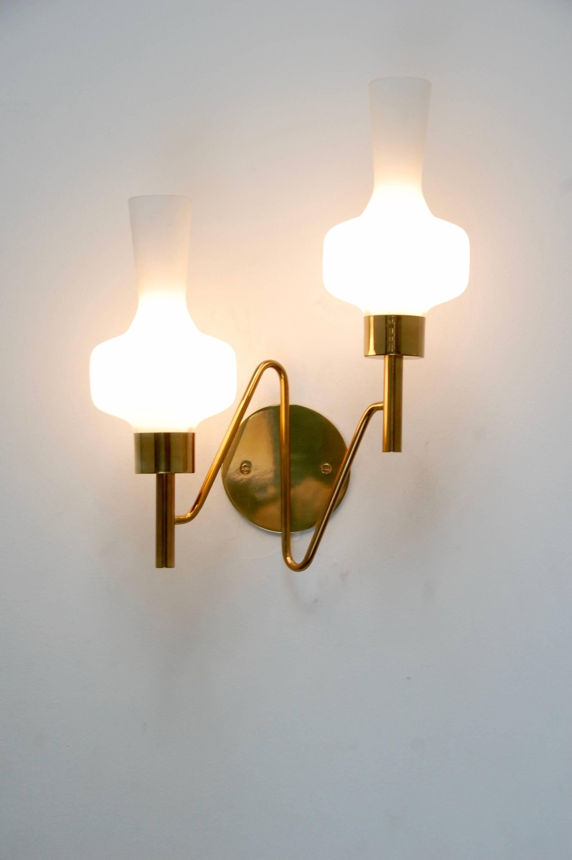 Single brass and glass double shade sconce from Mid-Century, Italy. Single E12 based socket per shade. Ready for use in the US.