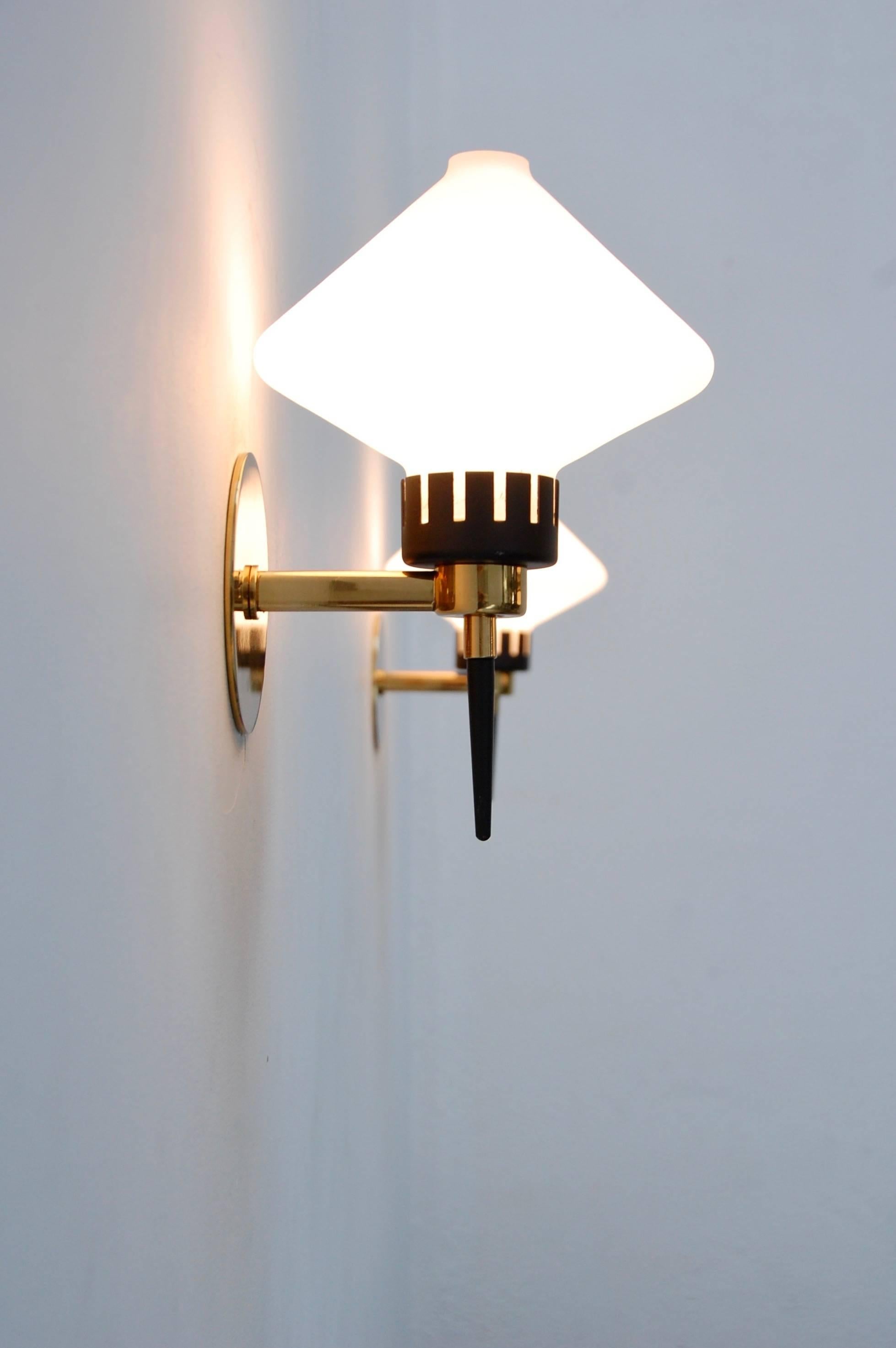 Classic modern sconces from Italy. Single E12 candelabra based socket per sconce, 60 watts max per sconce.