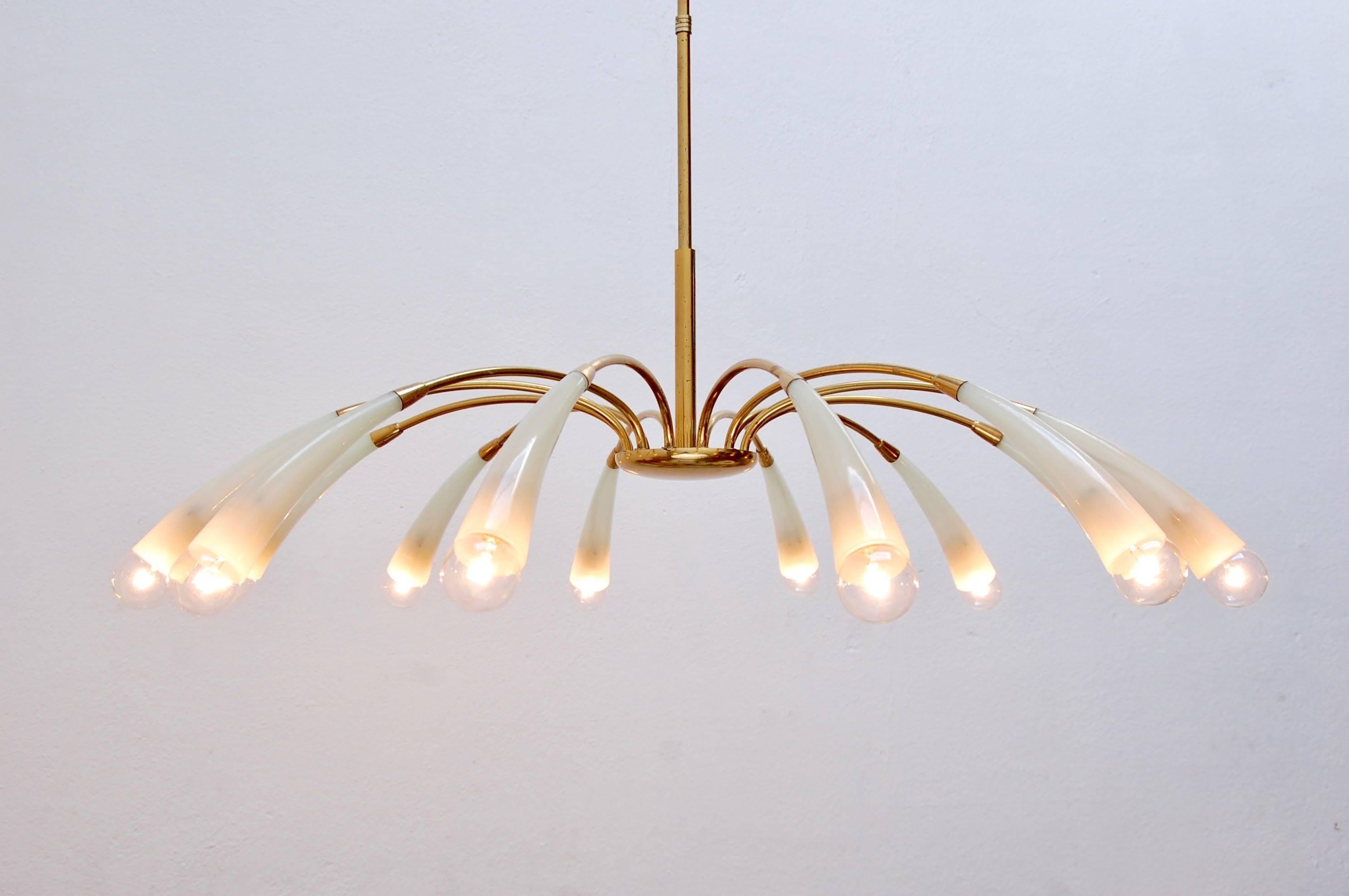 Stunning twelve-light large fluted glass chandelier from 1960s, Italy. Beautifully naturally aged brass and elegant fluted arms. 
Measures: OAD: 30”,
Diameter: 40”,
Chandelier height: 9”.
 
