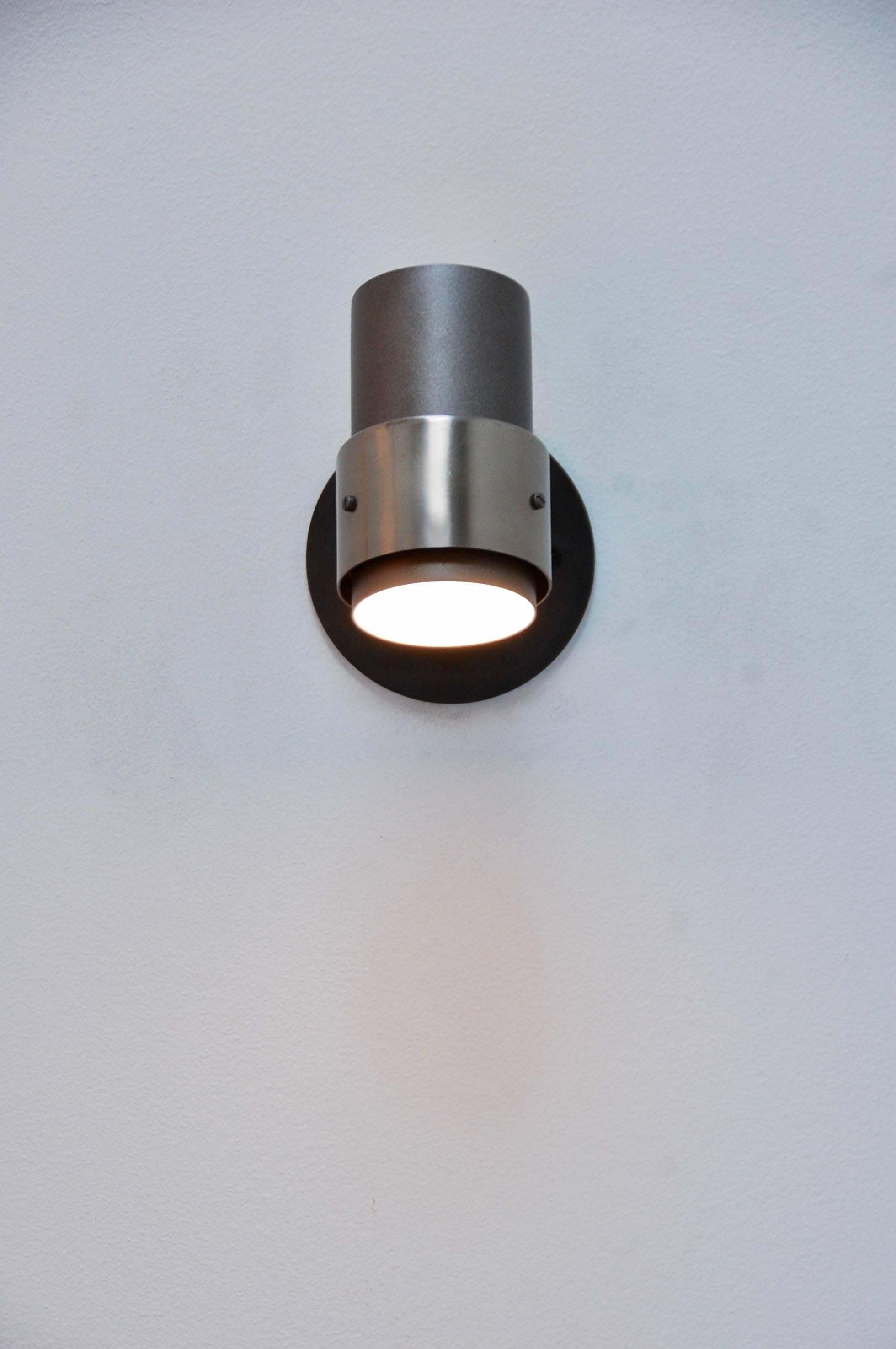 Full range Directional cylinder sconces from 1950s, Italy. Adapted for use in the US. 
Measures: Height 4.5”.
Depth: 6.25”.
Width: 4”.
Shade height: 4 3/8”.
Shade width: 3”.
 