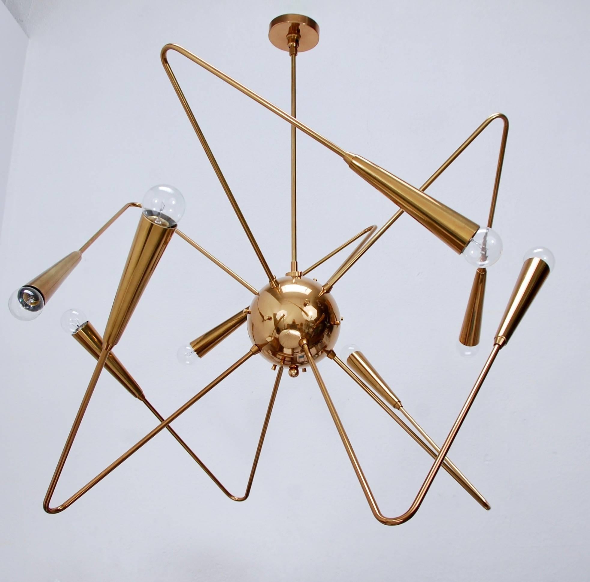 Stunning LU brass Sputnik chandelier in the spirit of Mid-Century Modern design. Solid brass fabrication.
Measures: Fixture height 26”
Diameter 32”
Current drop 36”.
 