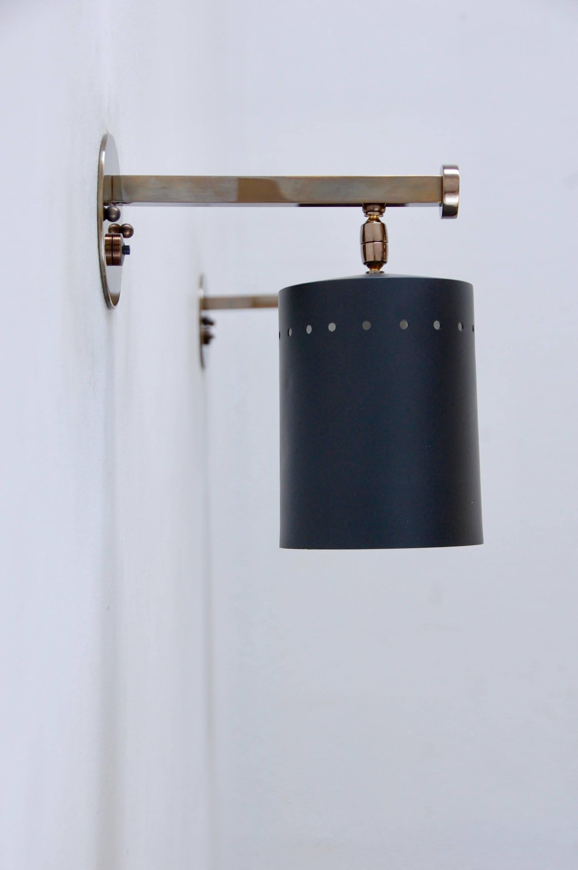 (2) wonderful Directional cylinder sconces that pivot generously for directed light. Patinated unlacquered brass, and painted aluminium. Rewired for use in the US. Priced individually.
Measures: Depth 8.75”
Height 10
Width 4.5”
Shade dimensions 4.5”