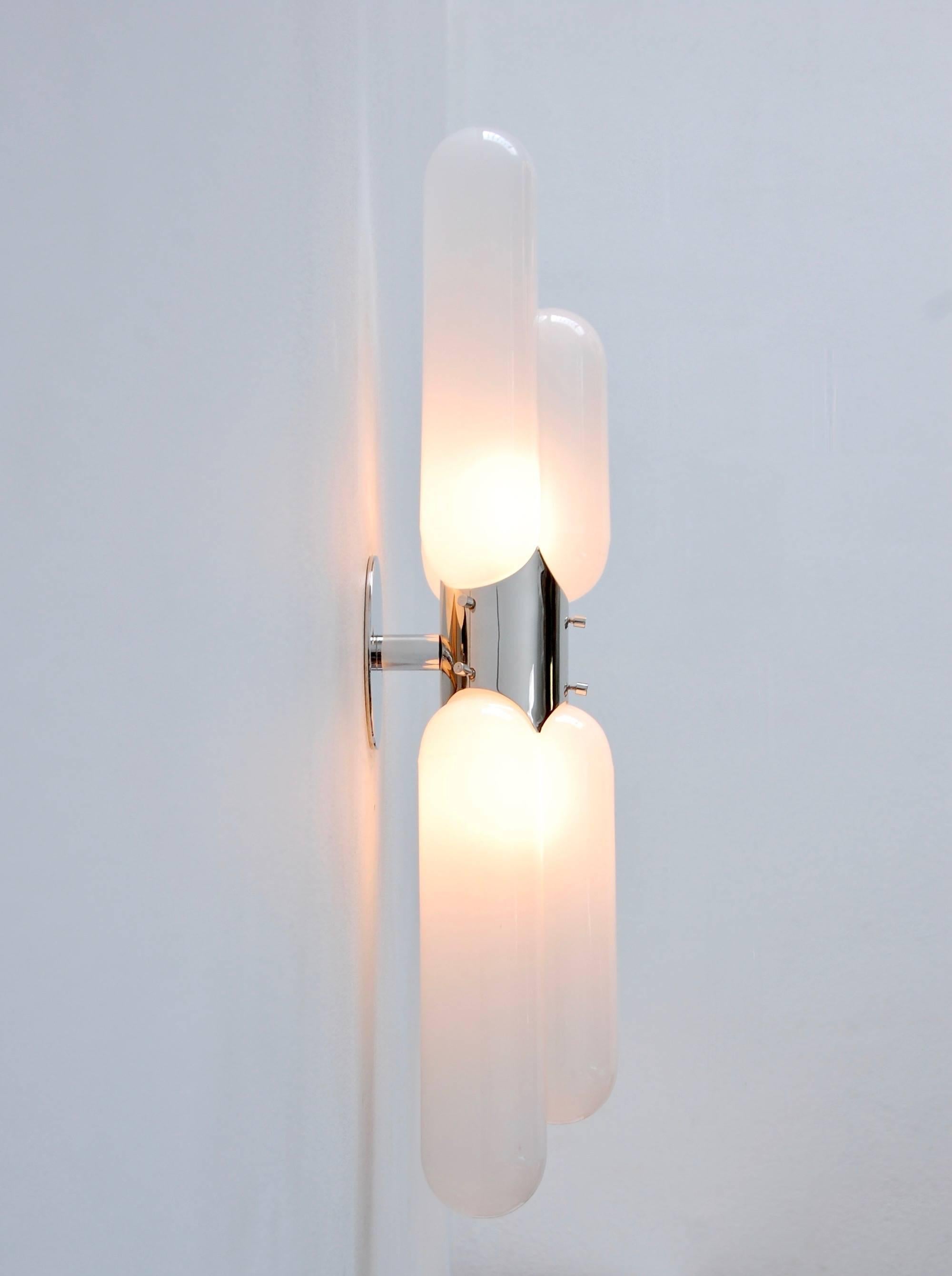 Five sconces of stunning glass, brass and nickel tubular sconces from Italy by Carlo Nason for Mazzega. Modern 1960s Italian lighting design. Two E26 light sockets per sconce. Fully restored and ready to use.
We at Lumfardo Luminaires do all the