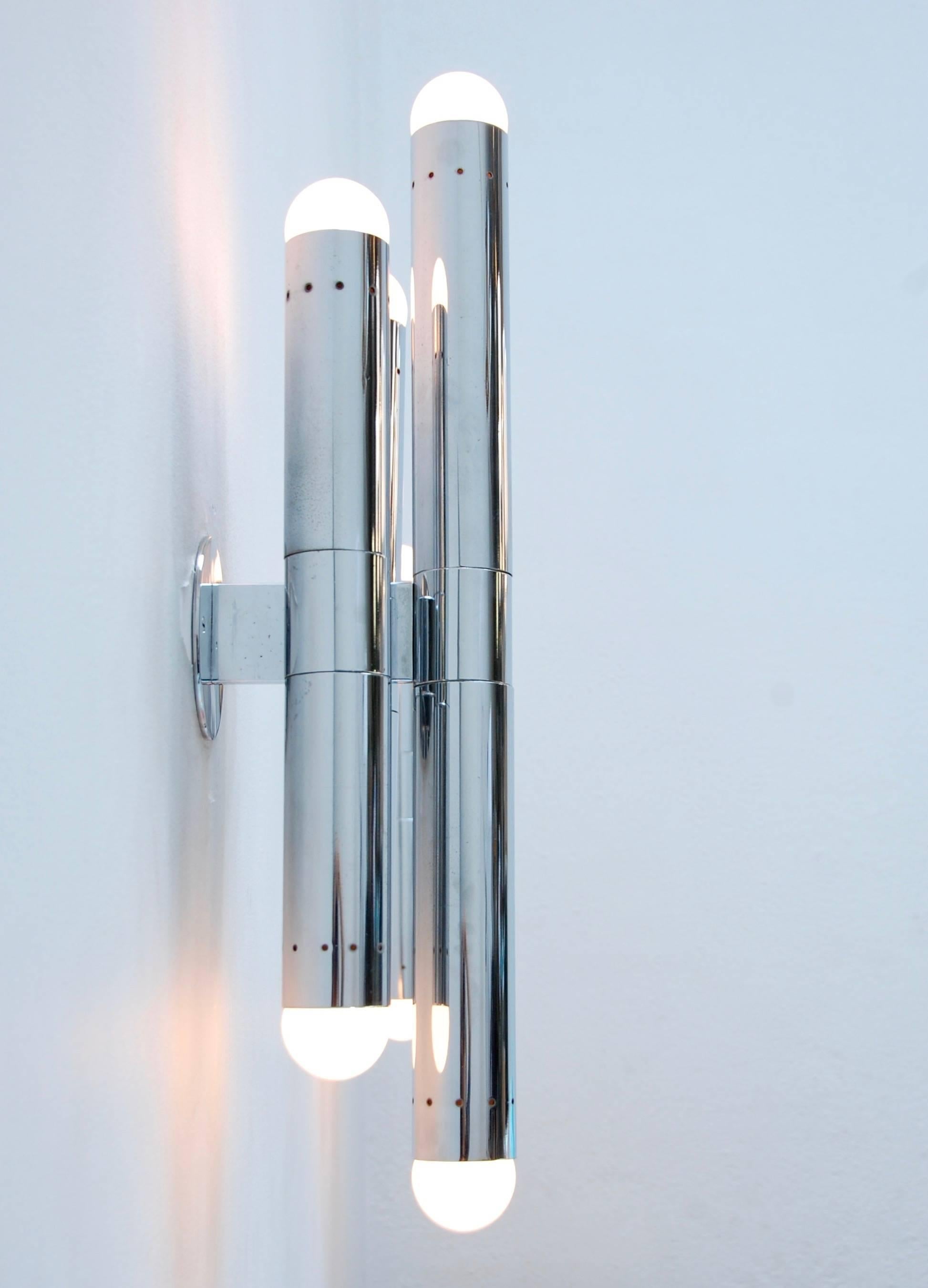 A pair of large fantastic chrome tubular sconces from Italy by Lamperti. Modern 1960s Italian lighting design. Six-E26 light sockets per sconce. Partially restored (rewired) with original finish. Ready to install. 4