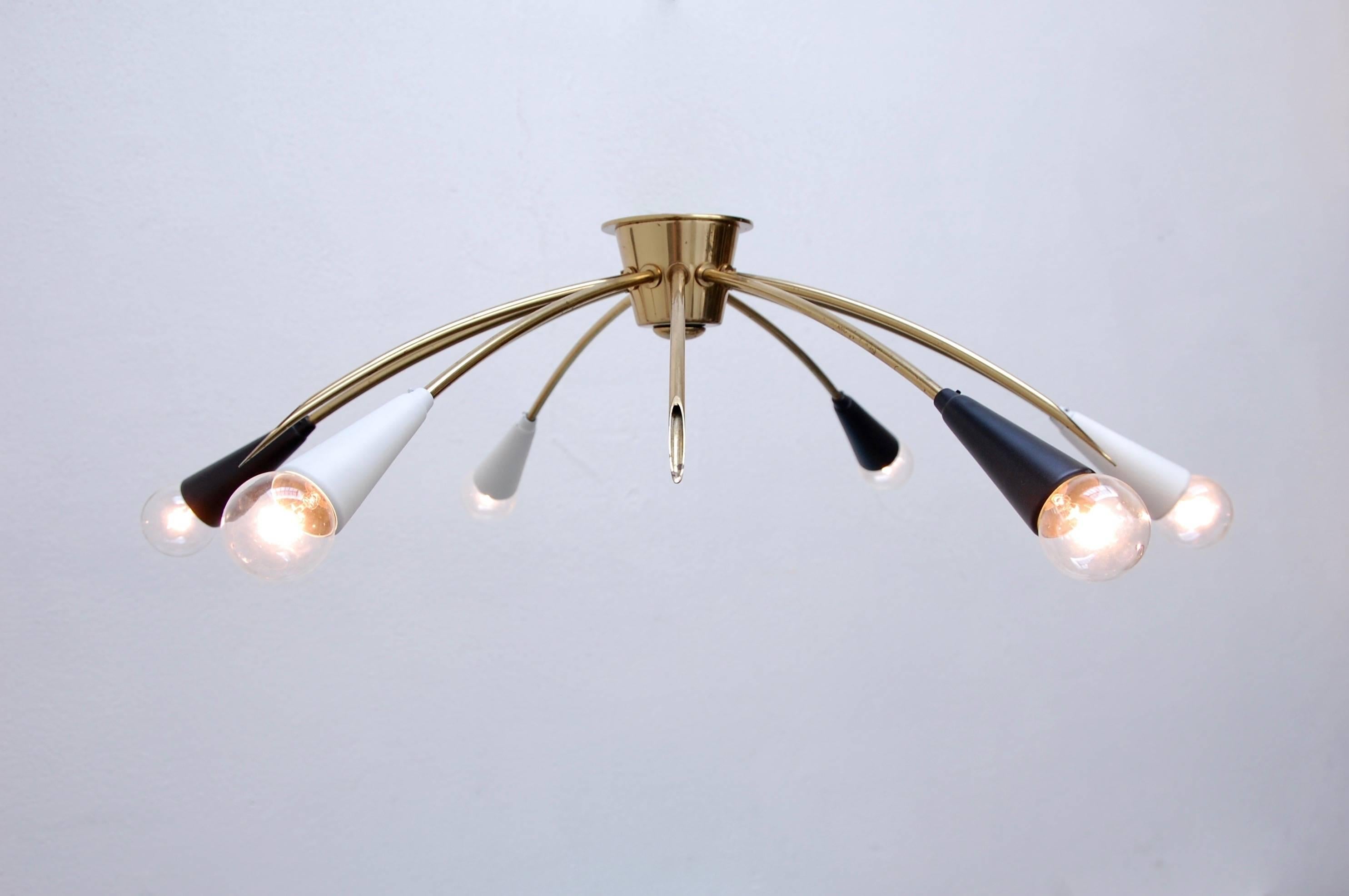 Pristine modern flush mount fixture from 1950s Germany in brass and two-tone painted aluminum. Partially restored, original socket covers, six E12 Candelabra based light sockets, rewired for use in the US.

We at Lumfardo Luminaires do all the