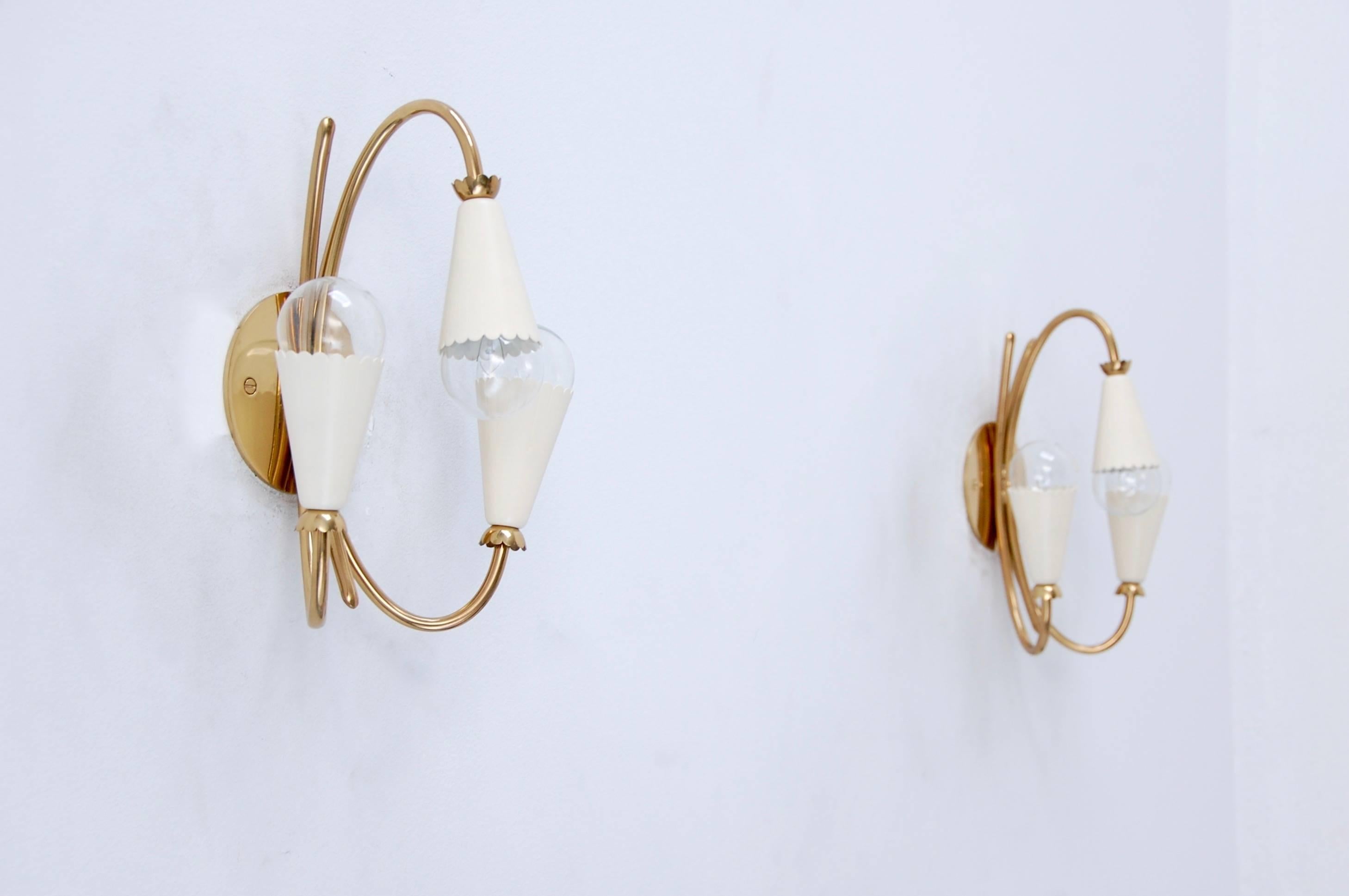 A lovely pair of Classic Italian botanical brass 1950s sconces. Fully restored, with (three) E12 candelabra based sockets per sconce. 
We at Lumfardo Luminaires do all the restorations of our vintage collection in house from our studio in Los