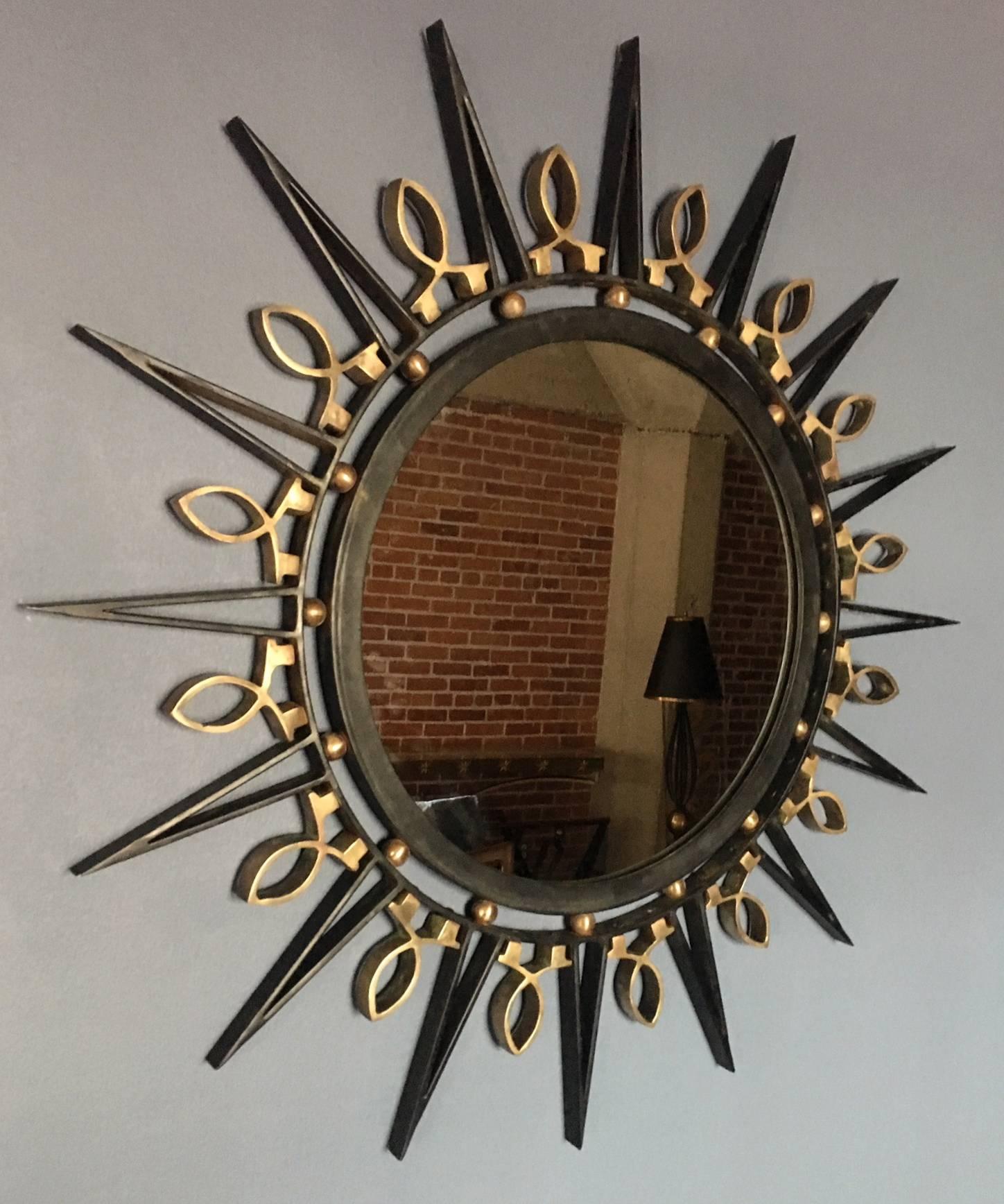 Exceptional wrought iron and brass mirror, by Arturo Pani. 
Executed in the workshop 