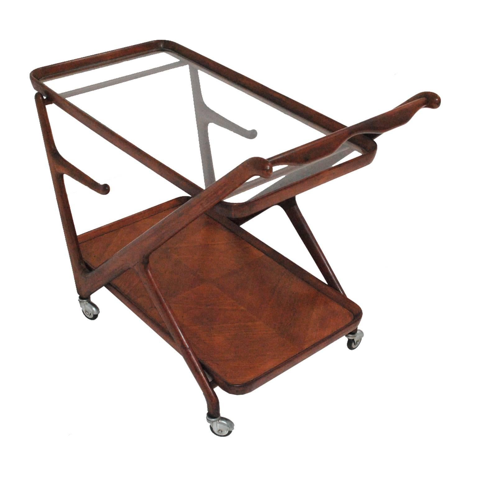 Cart designed by Cesare Lacca for Cassina, with structure made in solid walnut with crystal on top.