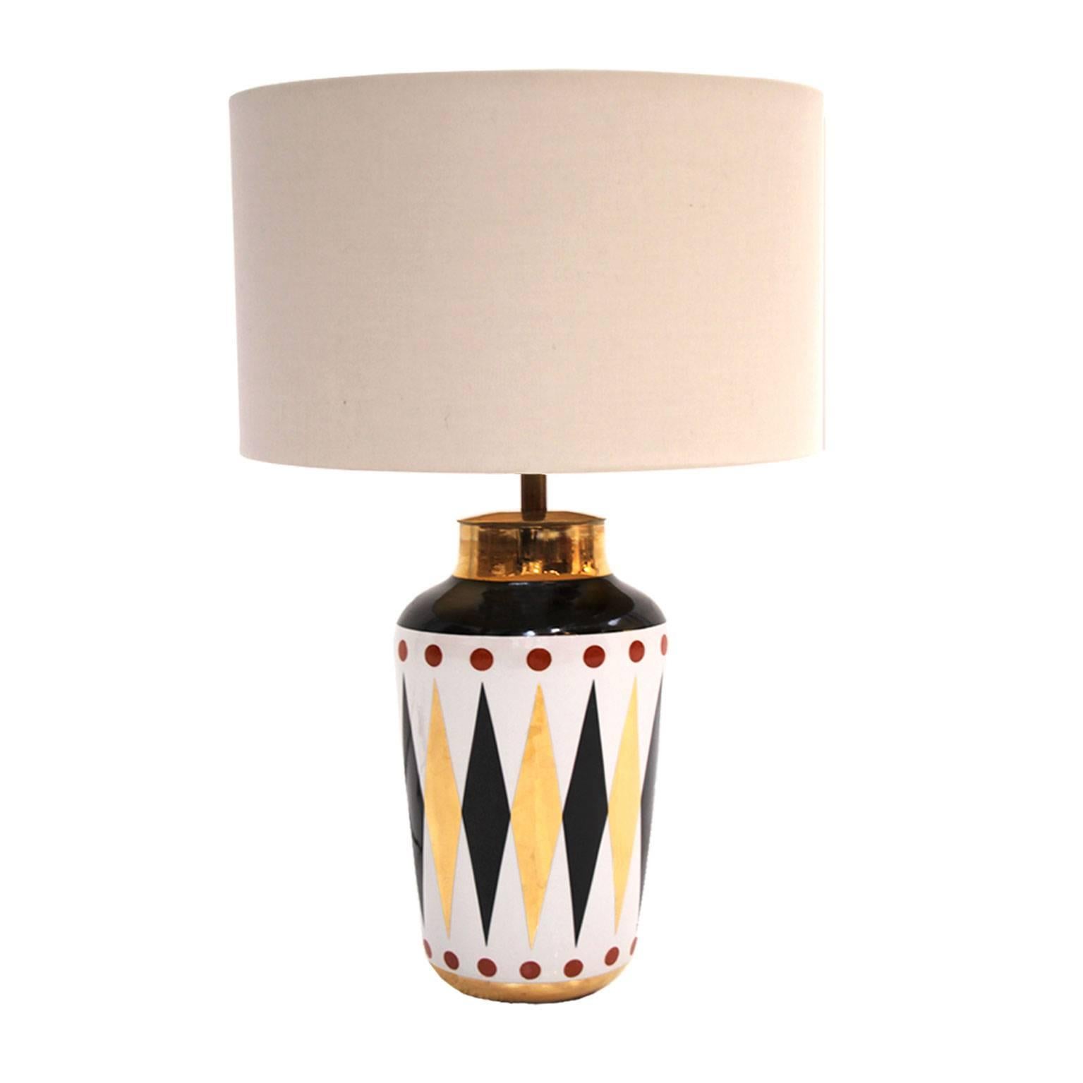 Pair of table lamps designed by Frederic de Lucas, made in porcelain and decorated with geometric patterns.