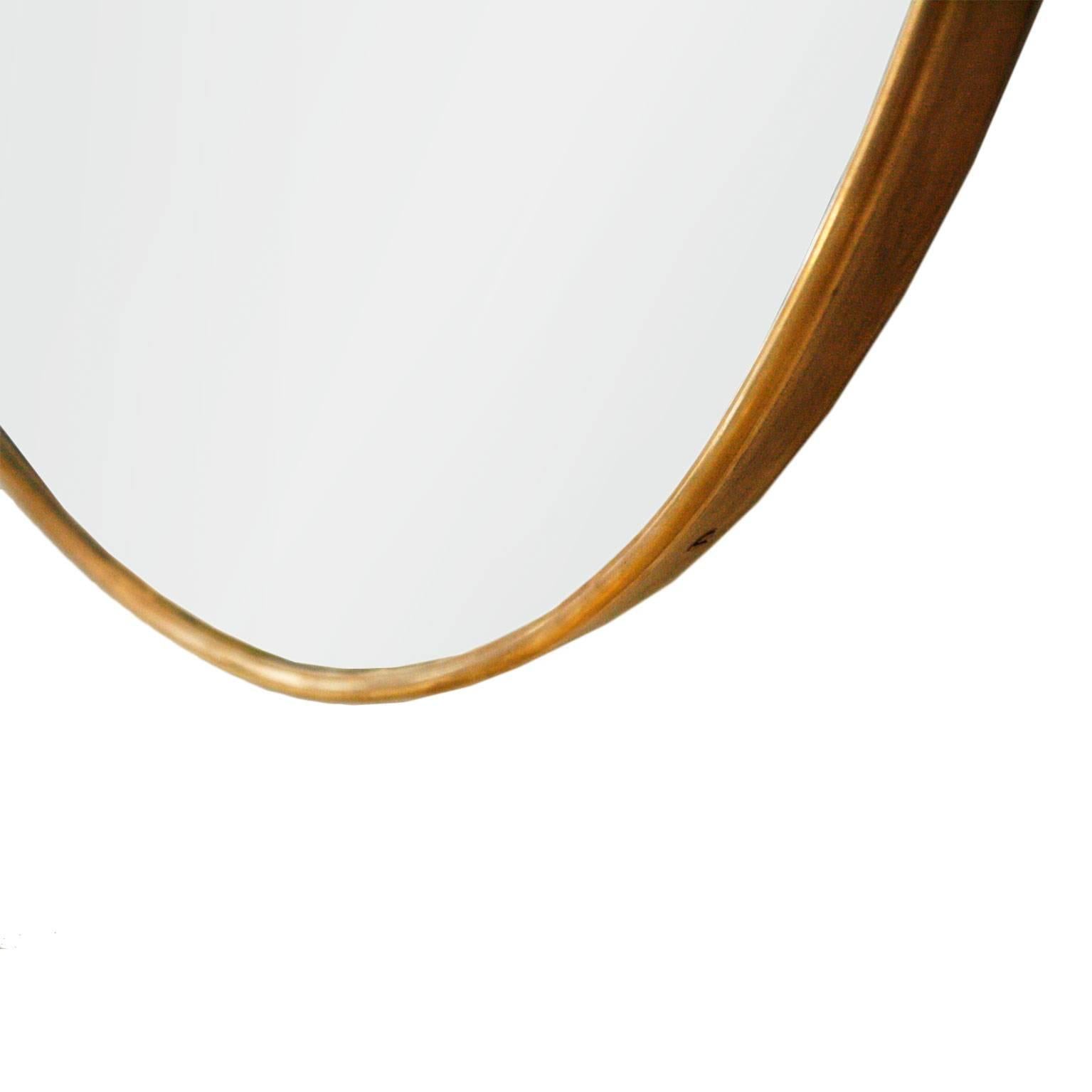 Pair of mirrors attributed to Gio Ponti, made in wood structure and frame in tube of brass.