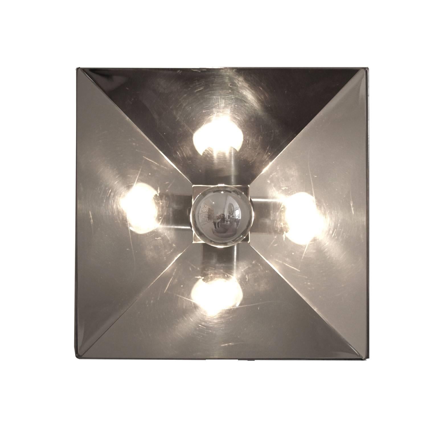 Set of five fall lights in quadrangular shape designed by Gaetano Sciolari. Made in steel with the light point placed in the middle.