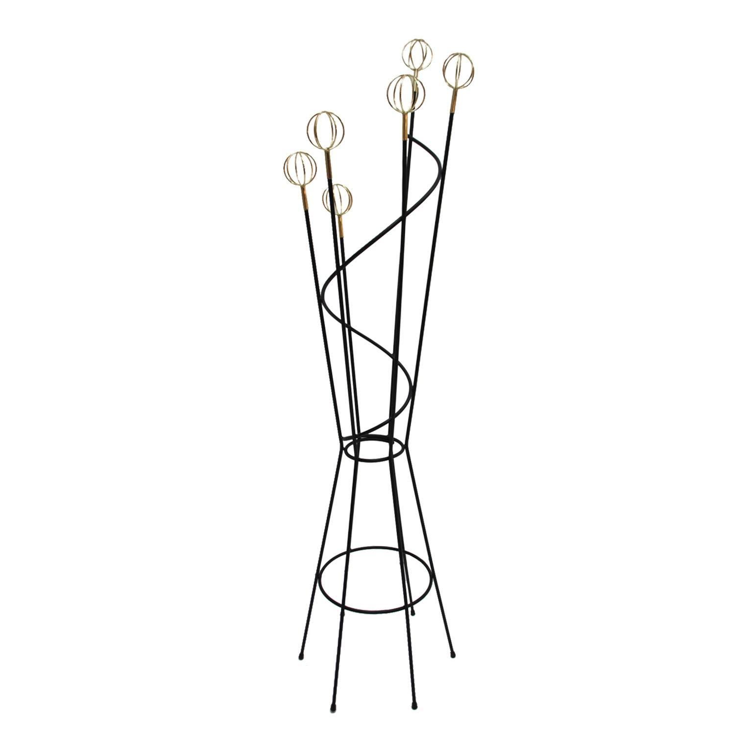 Coat stand designed by Roger Ferraud and edited by Geo, composed of six arms made in black lacquered iron finished in brass sphere, France, 1950.