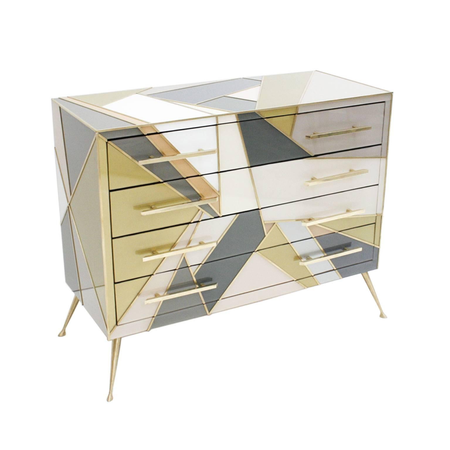 Chest of drawers composed of four drawers, handcrafted in solid wood, coated in Murano glass with brass finishes. Legs made in bronze. Italy.