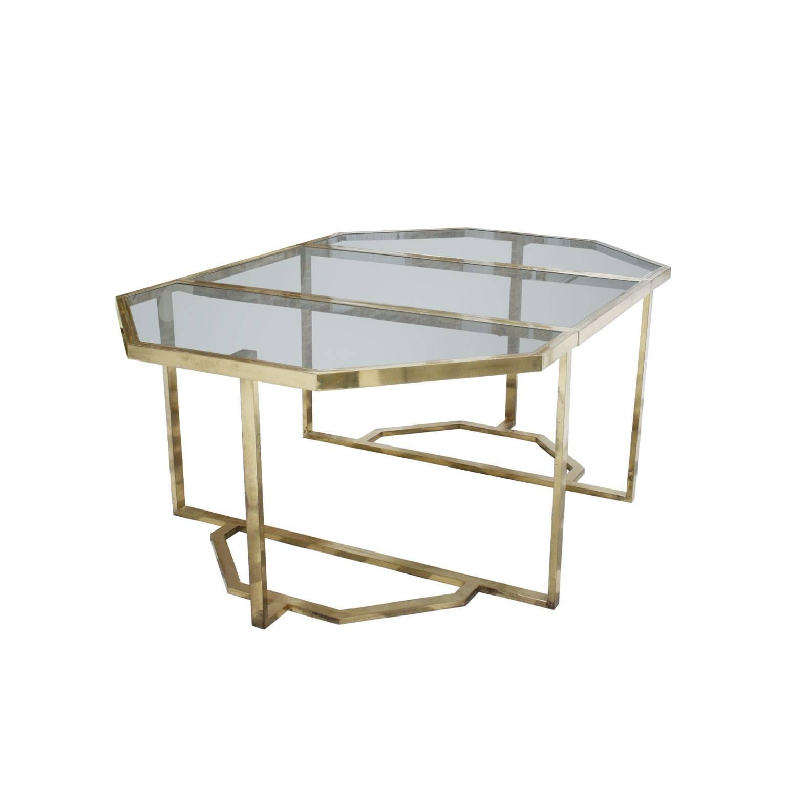 Dining table in style of Gabriella Crespi, made up of two independent bodies, convertible into a console, with a brass handcrafted structure and tan glass envelopes, Italy, 1970.