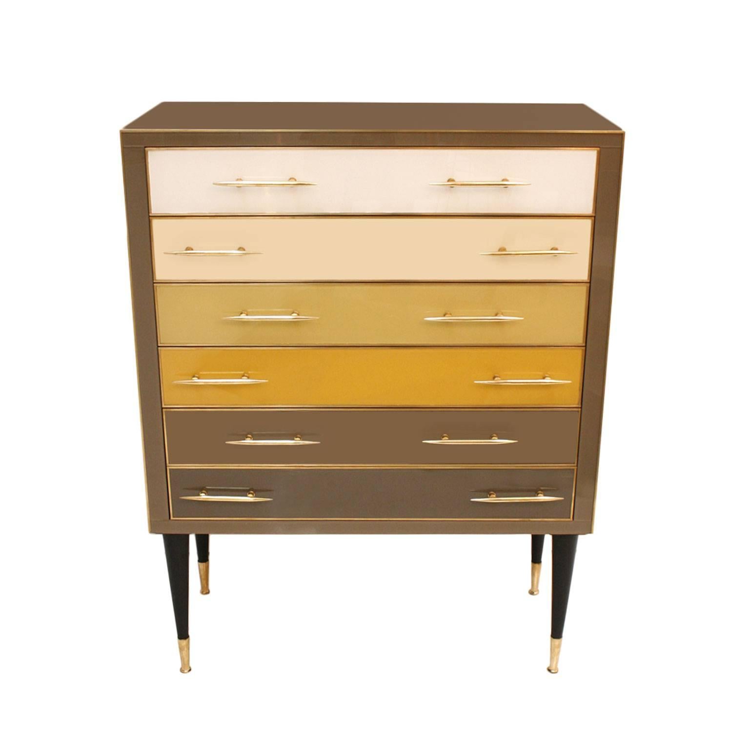 Chest of drawers made up of six drawers, with solid wood structure covered in Murano glass and brass details, Italy.