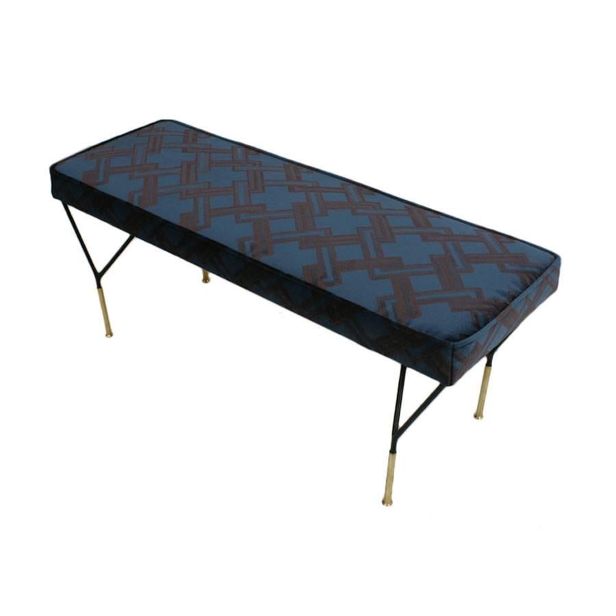 Bench with structure realized in iron, lacquered in black and legs finished in covers of brass. Velvet upholstery 