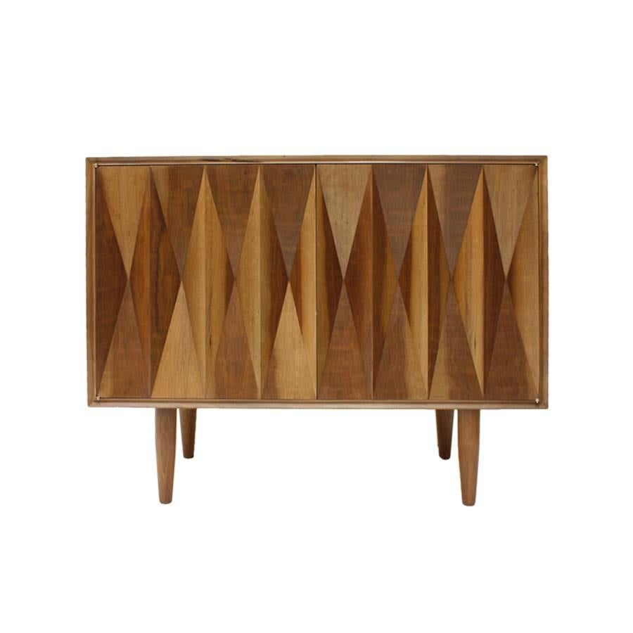 Pair of sideboards made up of two doors and shelves inside. Handmade in solid walnut wood, with geometric decoration on the front and conical shaped legs. Italy, 1960s.