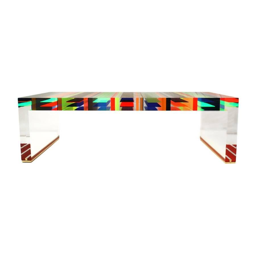 Single edition centre table designed by the Milanese studio Superego, made in plexiglass of different colors with seven centimeters thick and legs finished in brass.