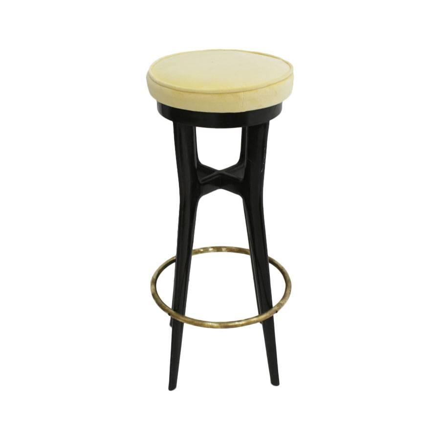 Pair of stools made in ebonized wood with details in brass and upholstered in yellow velvet, Italy, 1950s.