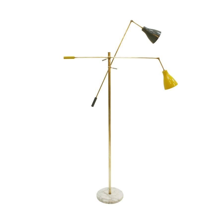 Floor lamp composed of two arms and adjustable cups with carrara marble base and brass structure.