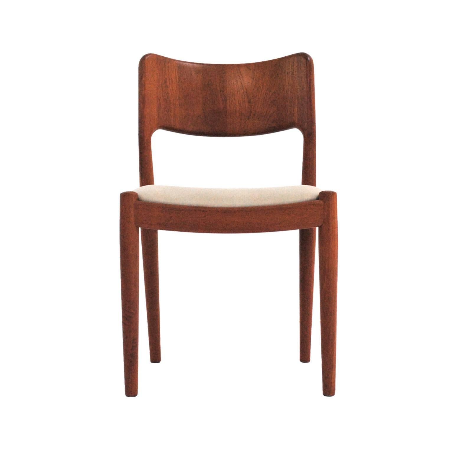 Set of four chairs designed by Niels Møller for J.L. Moller with structure made in solid cherrywood with seat upholstered in white wool.