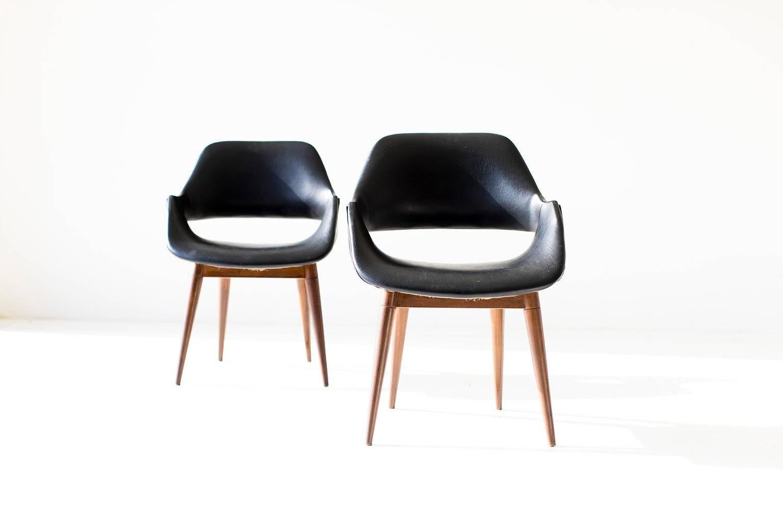 Designer: Arthur Umanoff. 

Manufacturer: Madison Furniture. 
Period or model: Mid-Century Modern. 
Specs: Vinyl, wood. 

Condition: 

These hard to find Arthur Umanoff chairs for Madison Furniture are in original vintage condition. The
