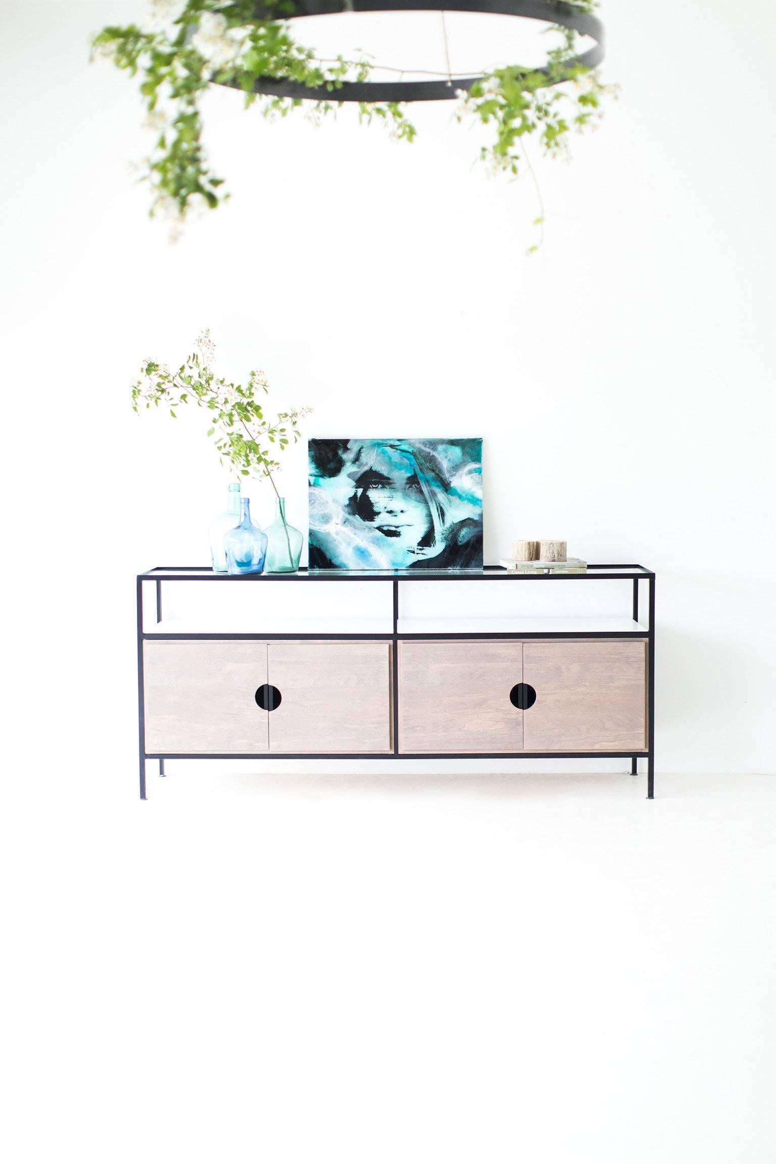 This Modern credenza is made in the heart of Ohio with locally sourced wood. Each unit is handmade with solid grey-washed pine OR black walnut and finished with a beautiful matte finish. The frame is hand welded steel and powder coated in matte