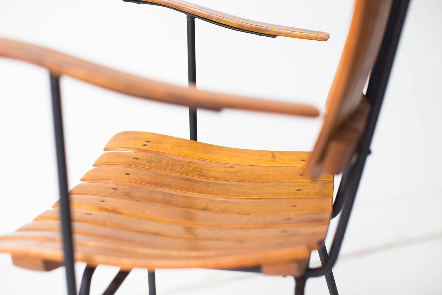 Designer: Arthur Umanoff.

Manufacturer: Raymor.
Period and model: Mid-Century Modern.
Specifications: Wood, iron.

Condition:

These Arthur Umanoff arm chairs for Raymor are in very good vintage condition. The wood is in very good vintage