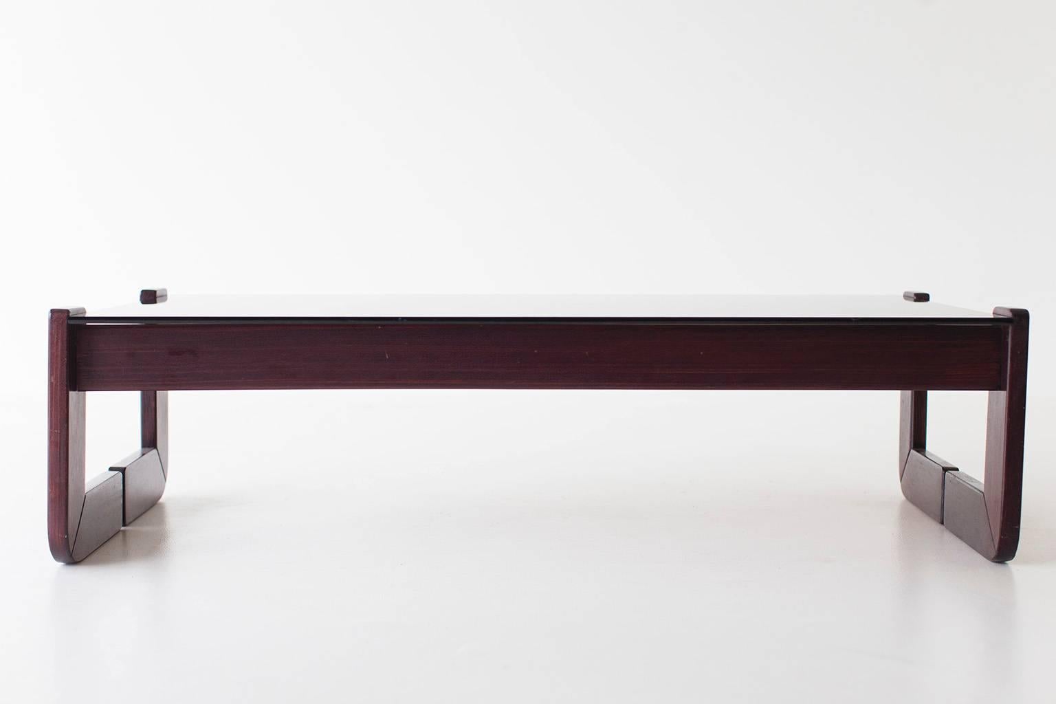 Designer: Percival Lafer. 

Manufacturer: Percival Lafer. 
Period or model: Mid-Century Modern. 
Specifications: Rosewood, glass. 

Condition: 

This Percival Lafer rosewood and glass coffee table is in very good original condition. The wood