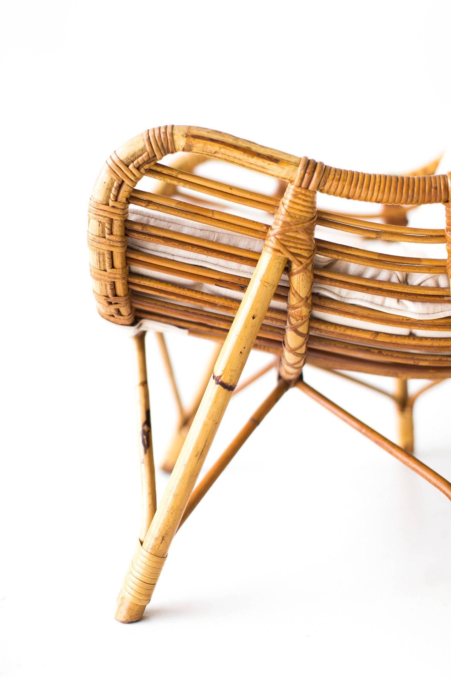 Designer: Unknown. 

Manufacturer: Laurids Lonborg.
Period or model: Mid-Century Modern.
Specs: Bamboo, wicker, fabric. 

Condition: 

These Danish bamboo and wicker lounge chairs by Laurids Lonborg are in very good vintage condition. The