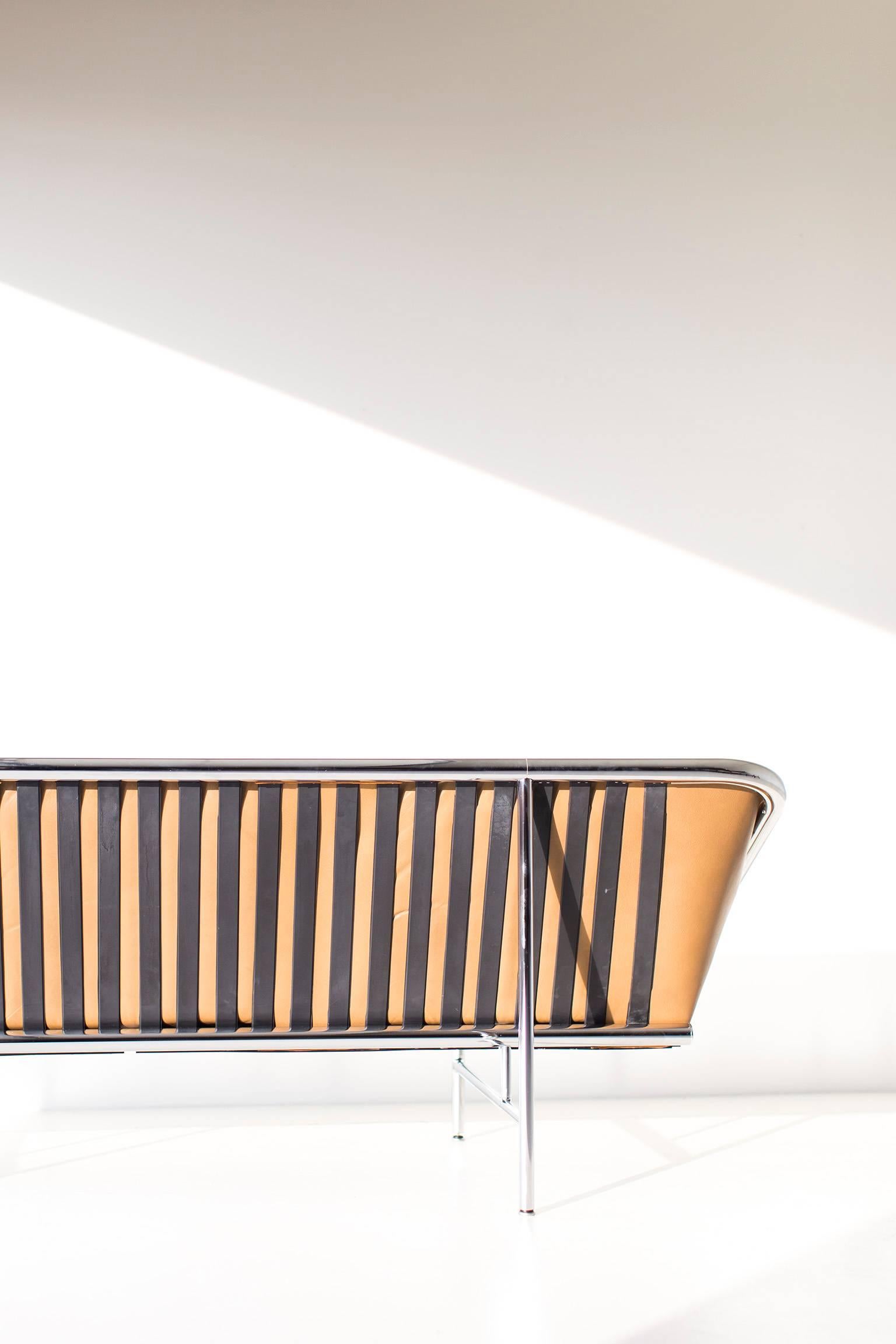 Designer: George Nelson. 

Manufacturer: Herman Miler.
Period or model: Mid-Century Modern.
Specs: Chrome-plated tubular steel, leather. 

Condition: 

This George Nelson sling sofa for Herman Miller is in very good vintage condition. The